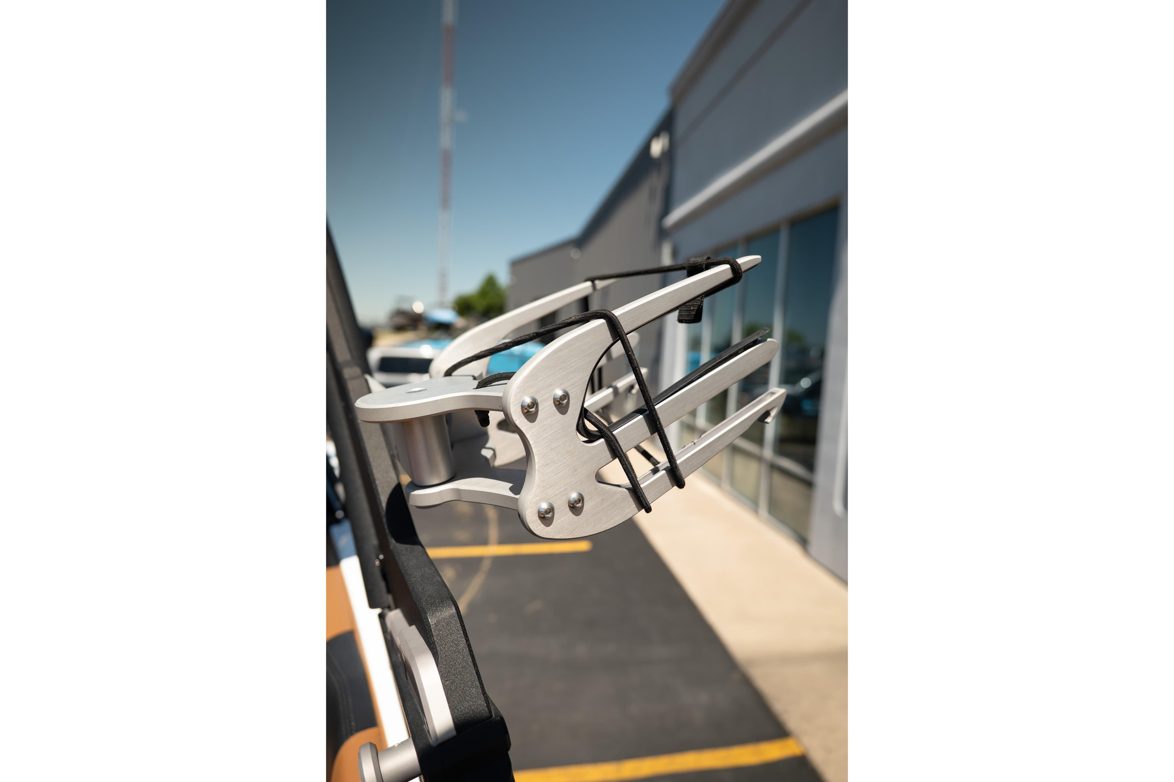 2022 Malibu Wakesetter 23 MXZ wakeboard rack detail in a sunny outdoor setting.
