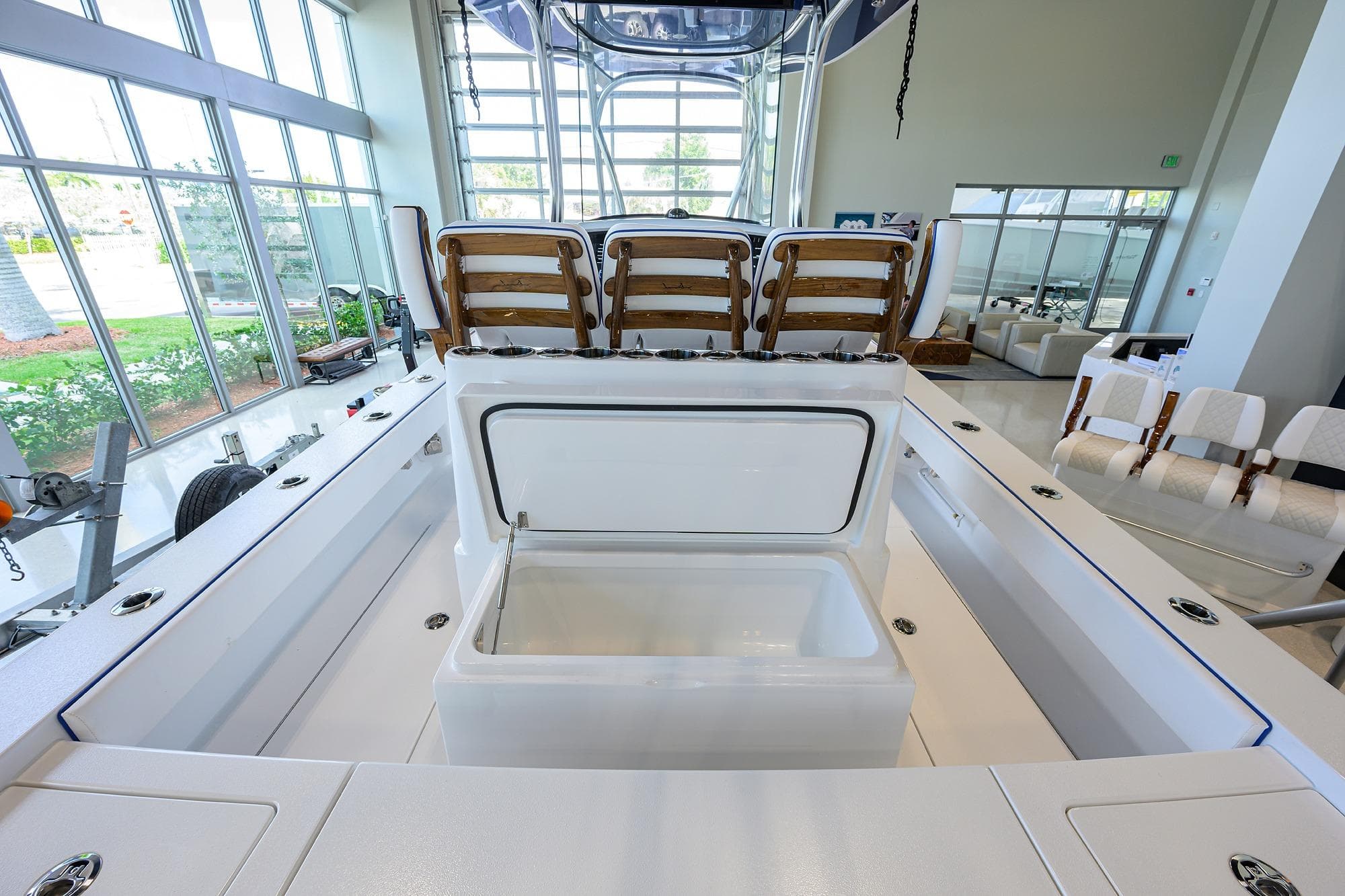 2026 Valhalla Boatworks V-28 Bay interior with seating and storage, showroom display.