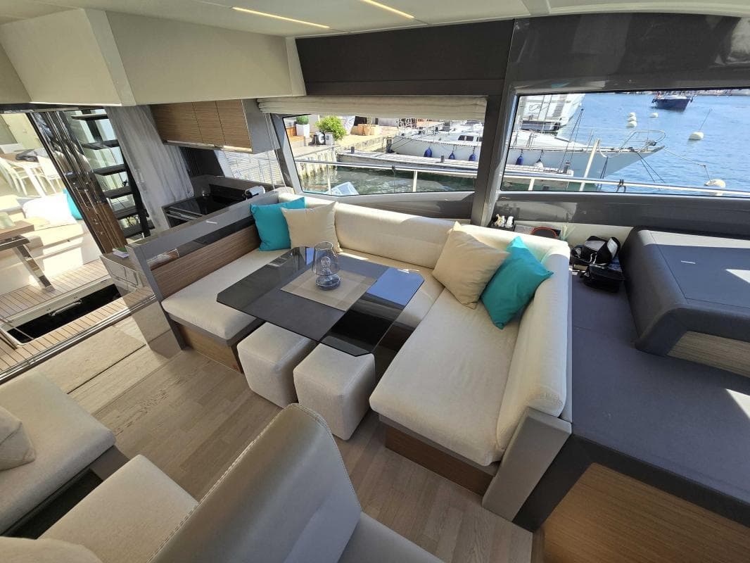 Luxurious interior of 2017 Ferretti Yachts 450 with elegant seating and waterfront view.