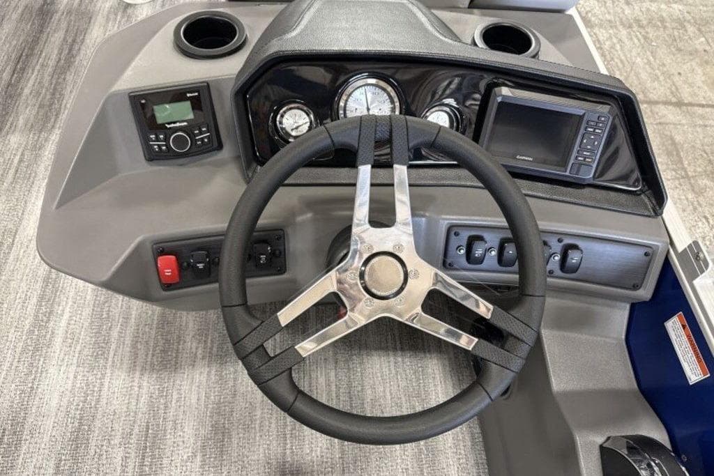 Steering console of 2026 Bennington 22SSB boat with gauges and controls.