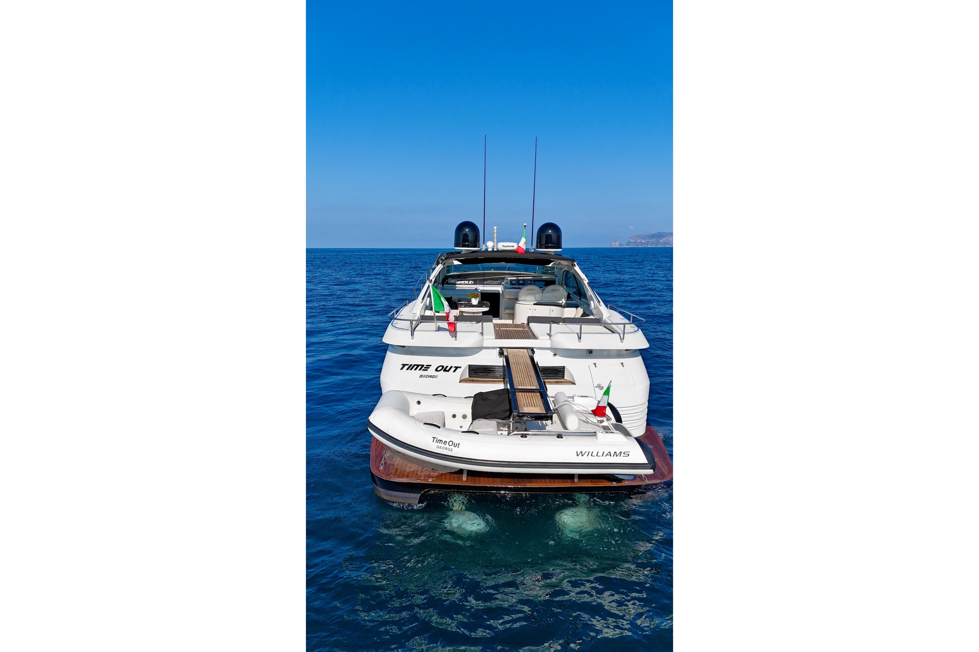 1995 Pershing 54 yacht "Time Out" on open sea, rear view.