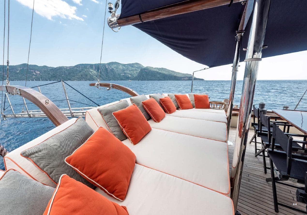 Luxurious deck of 1993 Custom Sailing Yacht Ocean Pure with plush seating and ocean view.