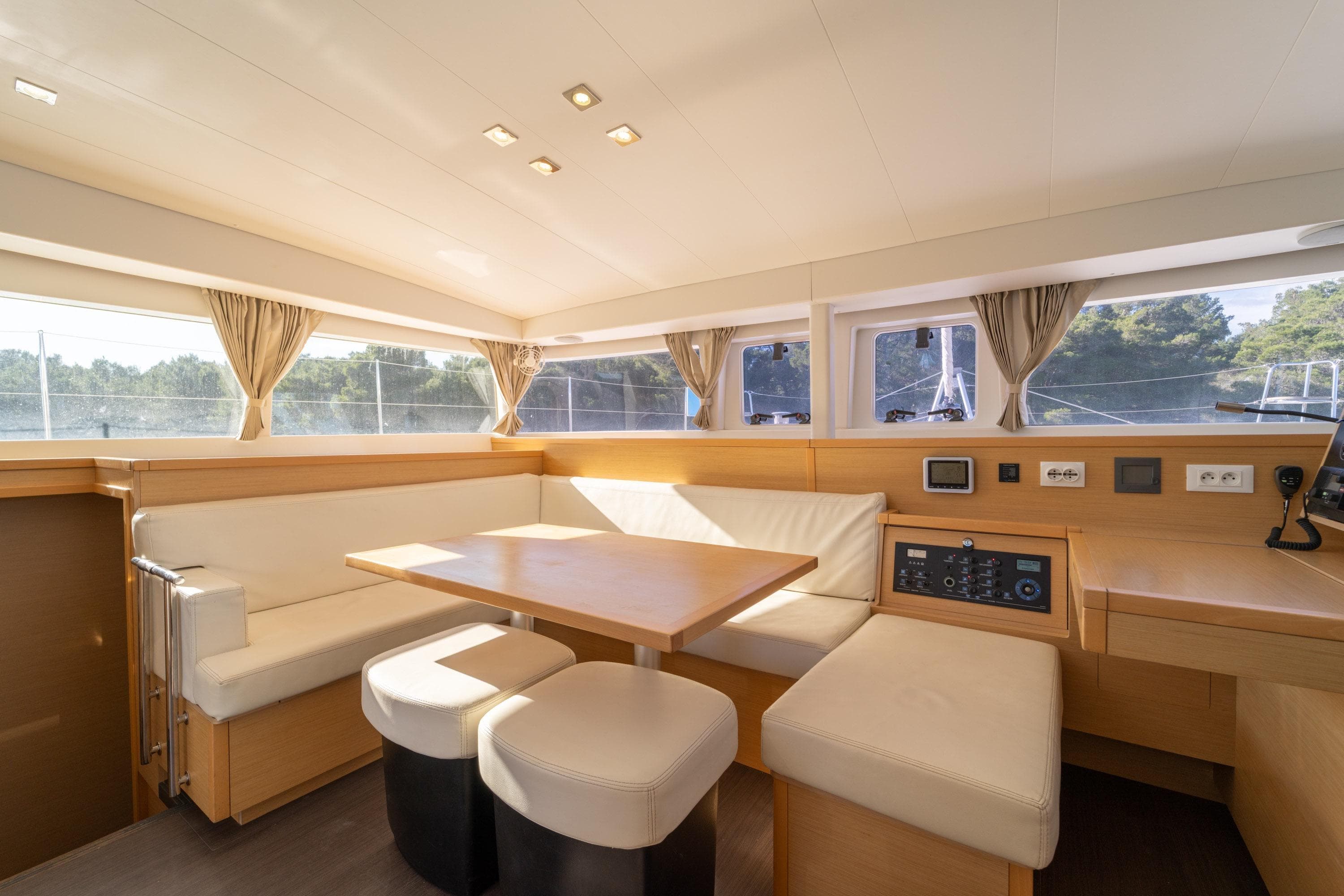 Interior of 2015 Lagoon 400 S2 yacht with modern seating and navigation controls.