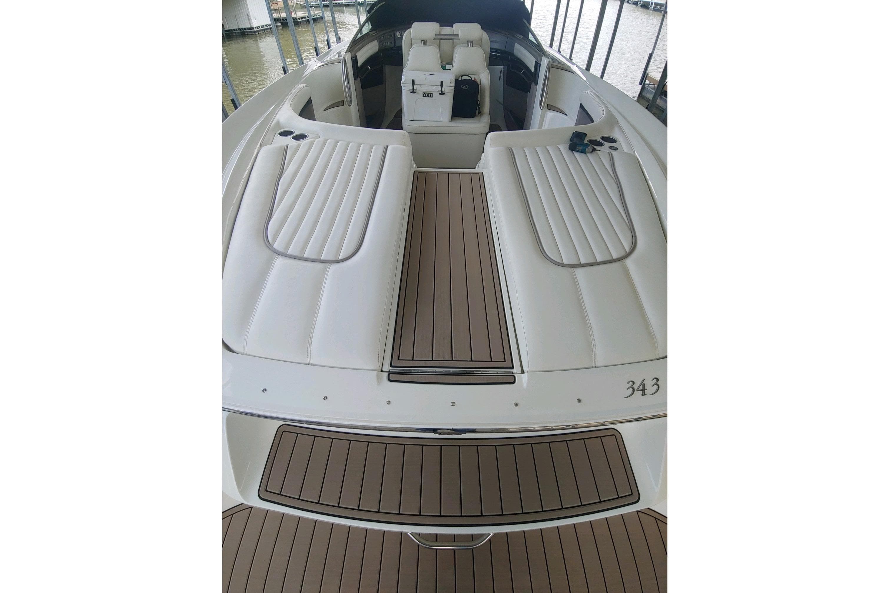 2004 Cobalt 343 boat with sleek white and brown deck design.