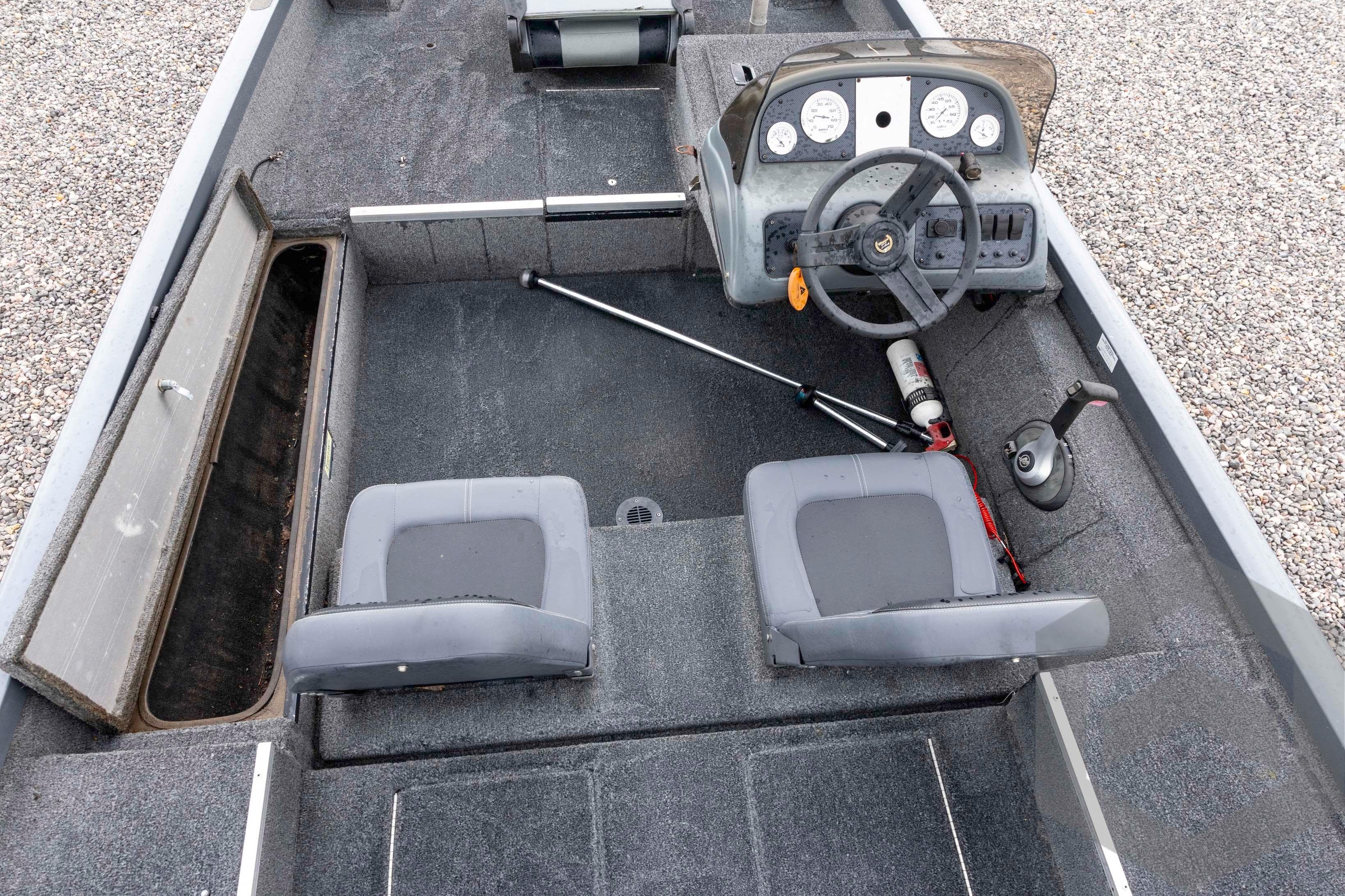 2007 Triton TC-17 boat interior with steering wheel and seating.
