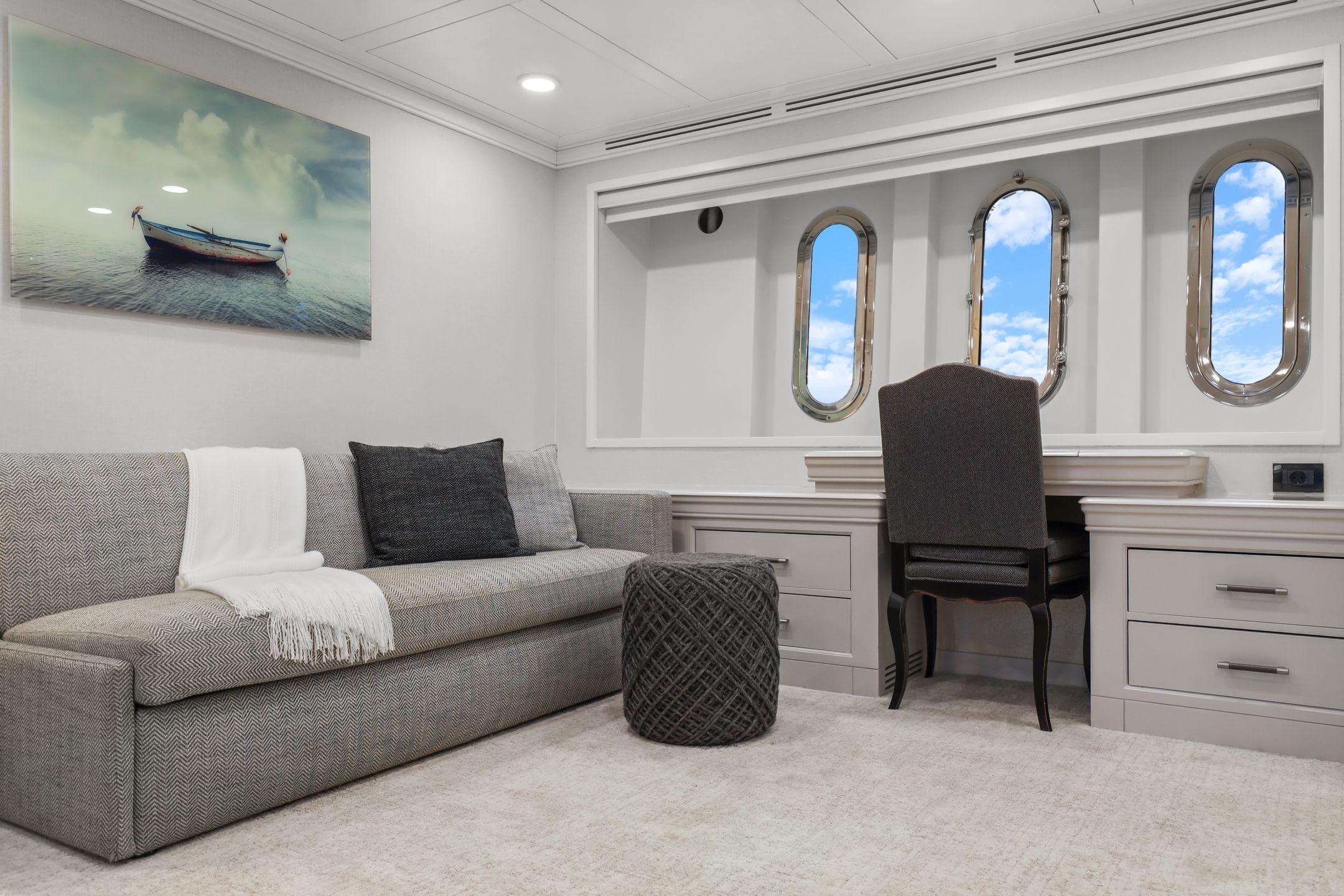 Luxurious interior of 2011 Mengi Yay 115 MY yacht with elegant seating and porthole windows.