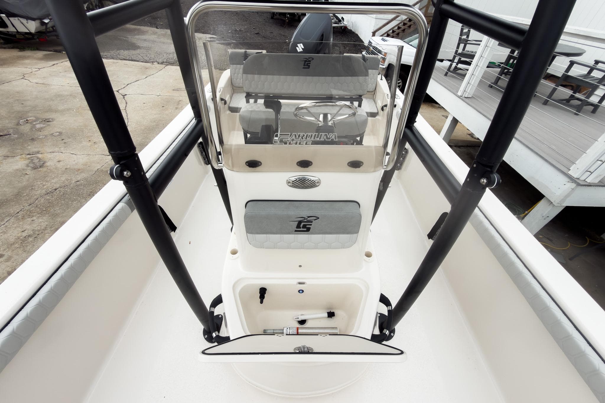 2026 Carolina Skiff 21 LS boat console with seating and steering wheel.