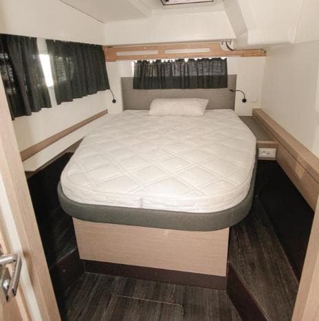 2023 Fountaine Pajot Catamaran Astrea 42 cabin with bed and modern interior design.