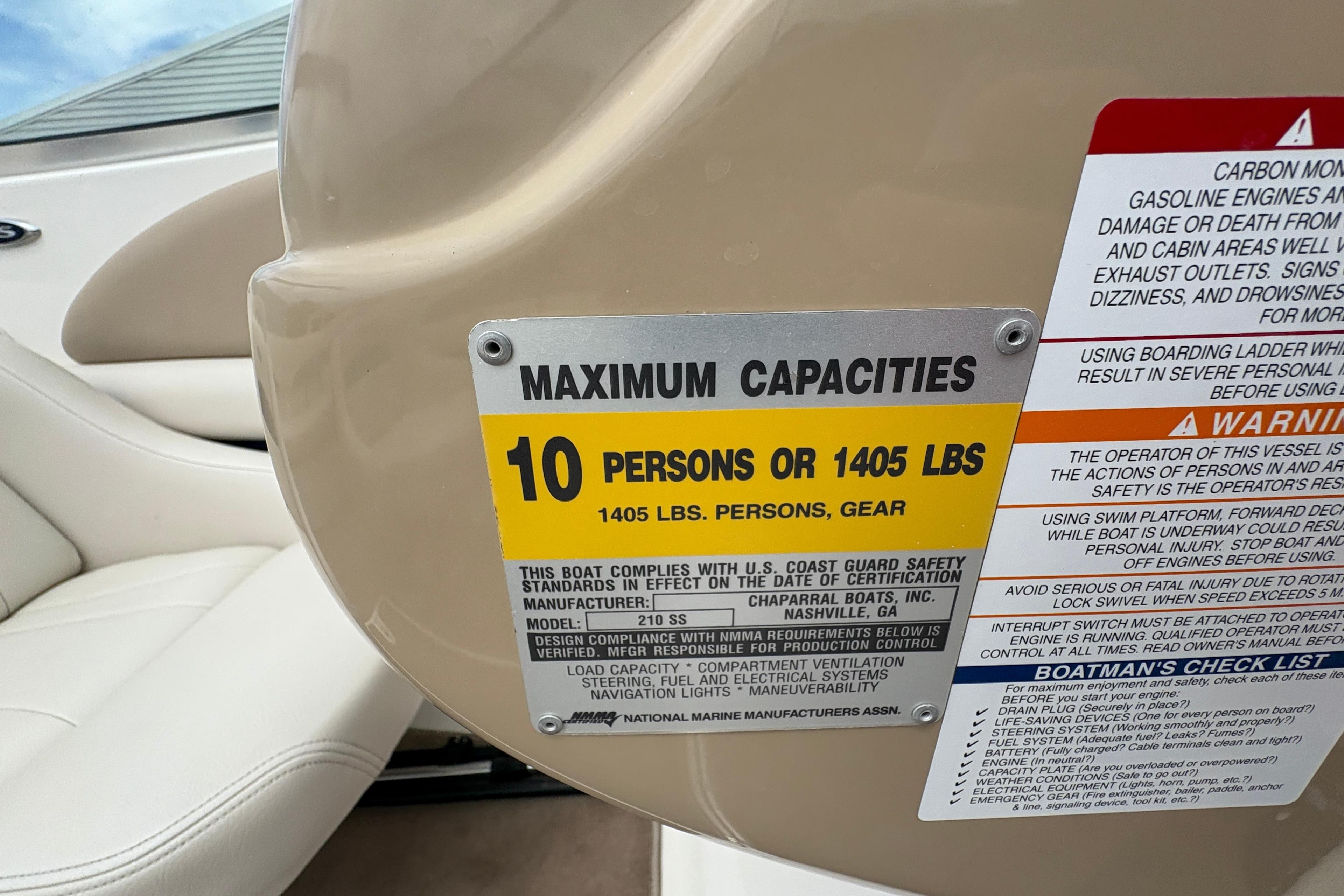 Capacity label on 2003 Chaparral 210 SS boat, maximum 10 persons or 1405 lbs.
