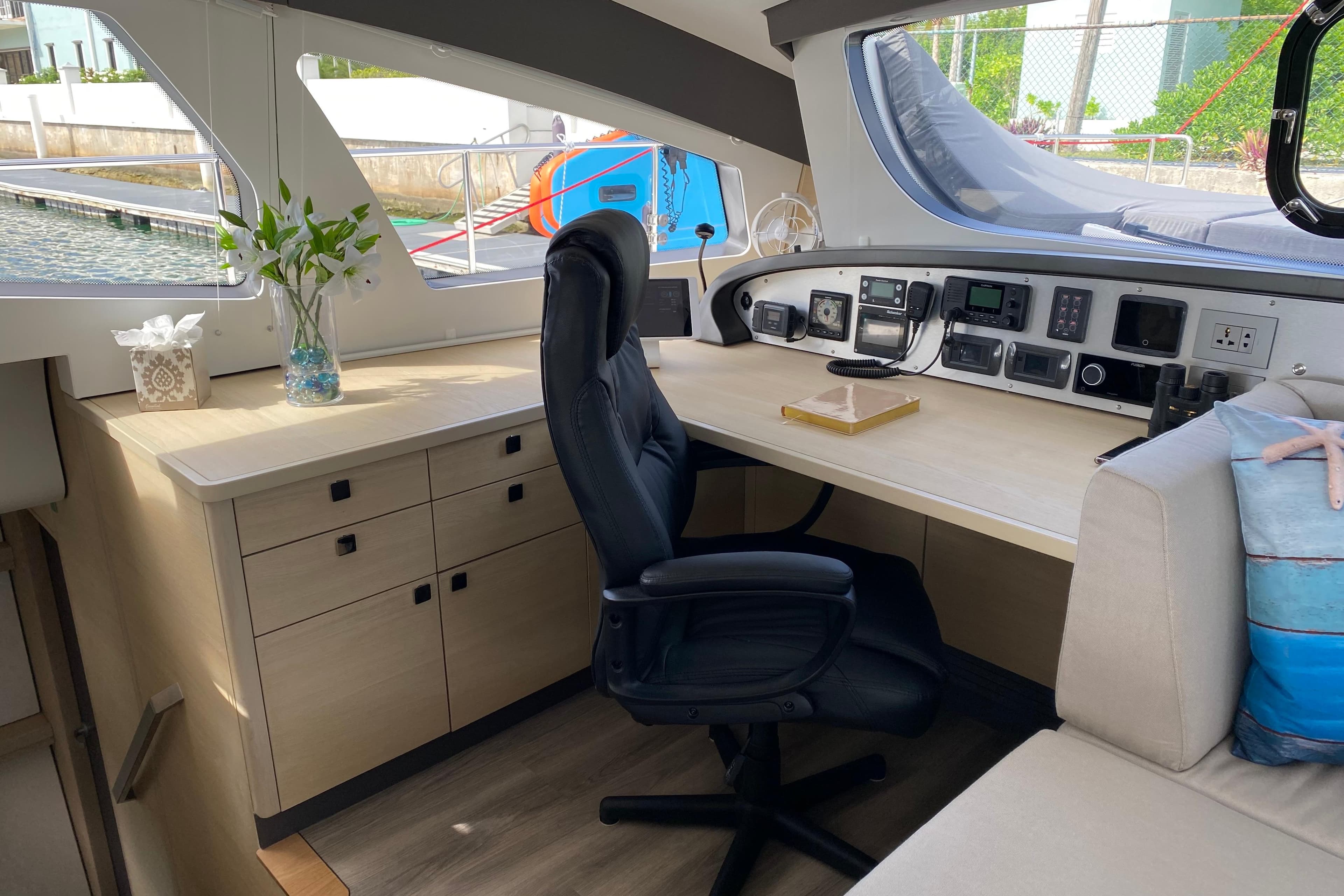 Luxurious 2023 Xquisite Yachts X5 PLUS interior with modern navigation station and comfortable seating.