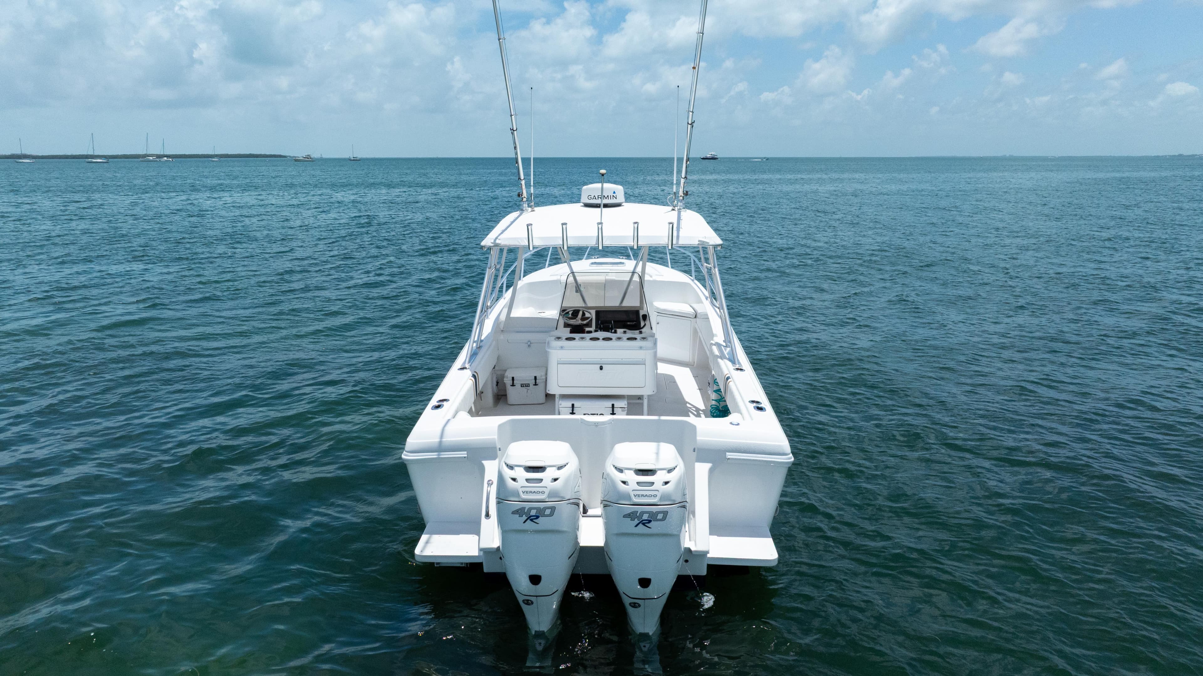1999 Intrepid 35 boat on open water, featuring dual outboard engines.