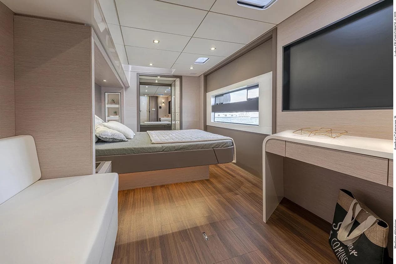 Luxurious interior of 2026 Aventura 56 Motor Yacht with modern bedroom design.