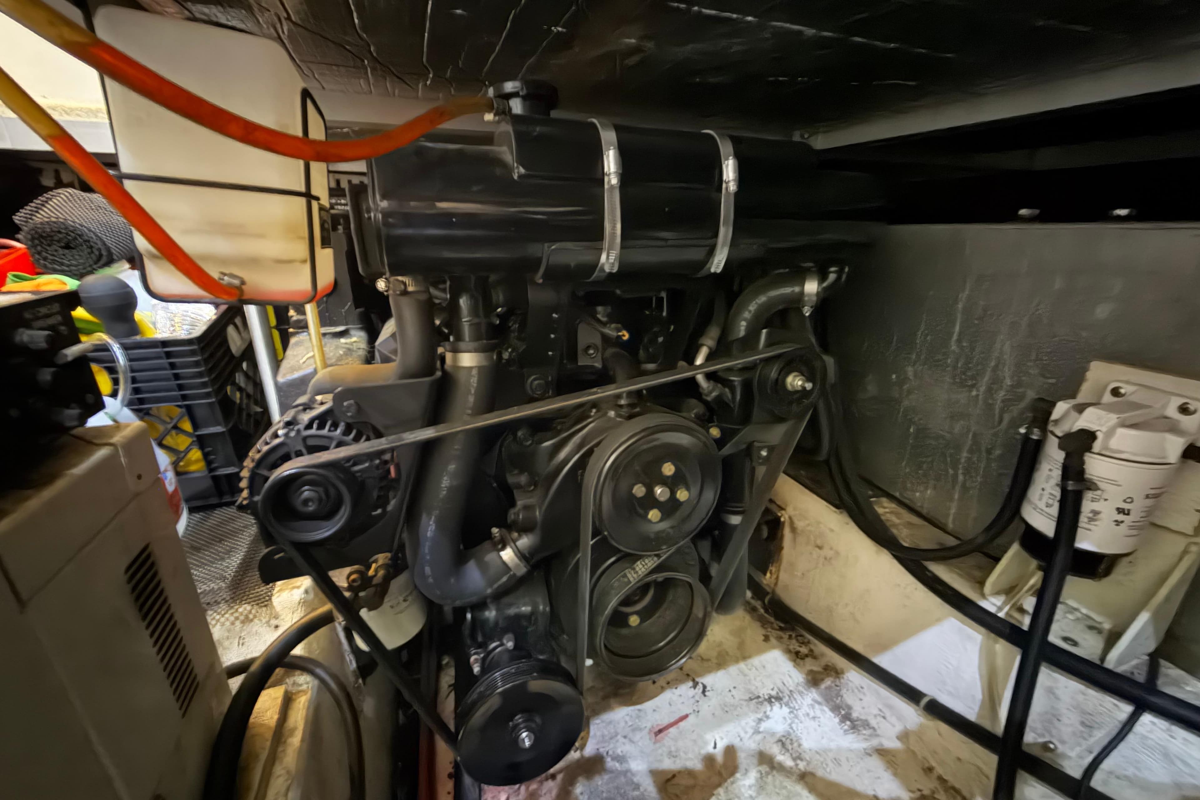 Engine room of 2000 Carver 356 Aft Cabin Motor Yacht, showcasing mechanical components.