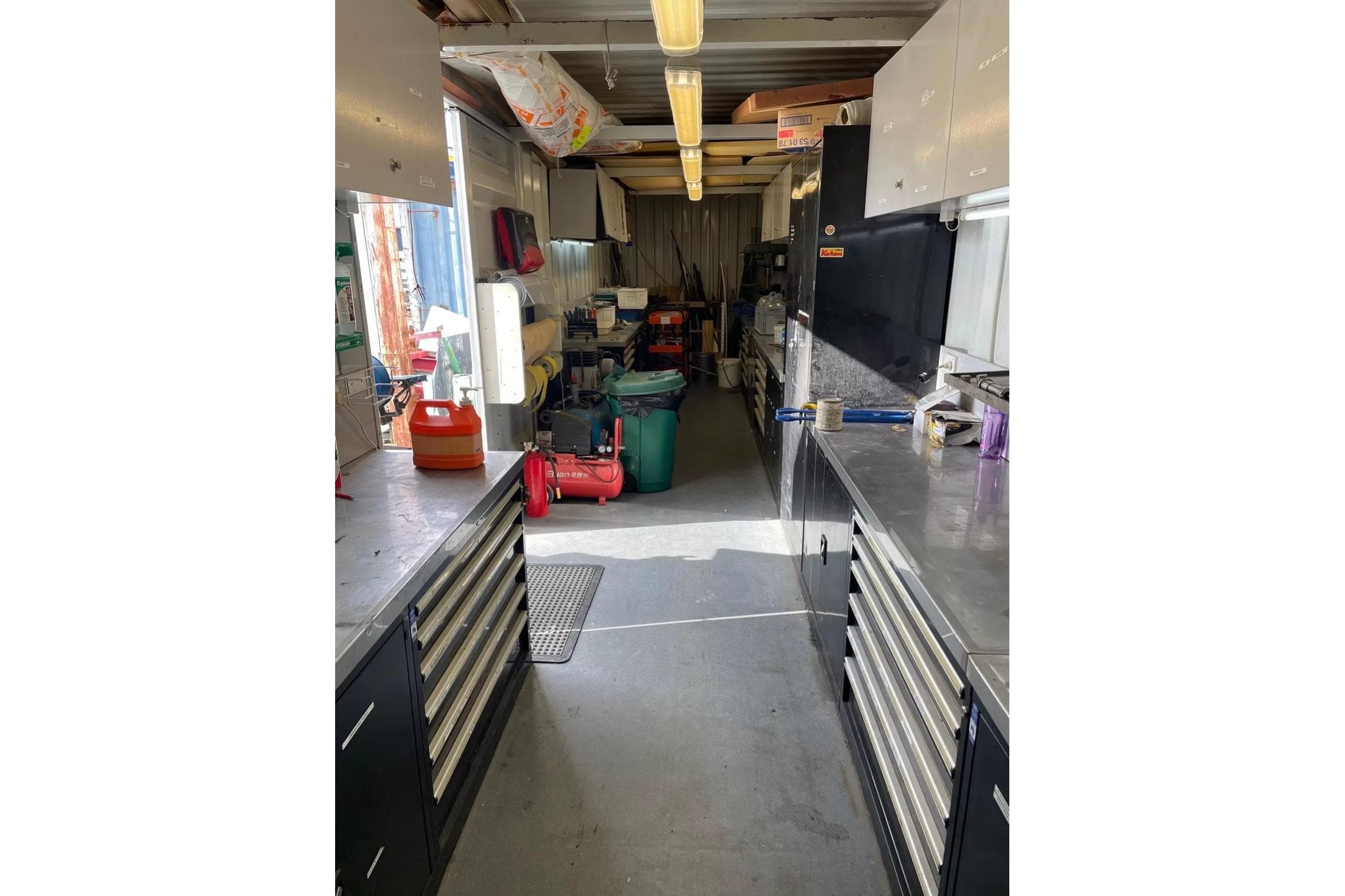 Workshop interior with tool cabinets and equipment, related to a 2011 Volvo 70.