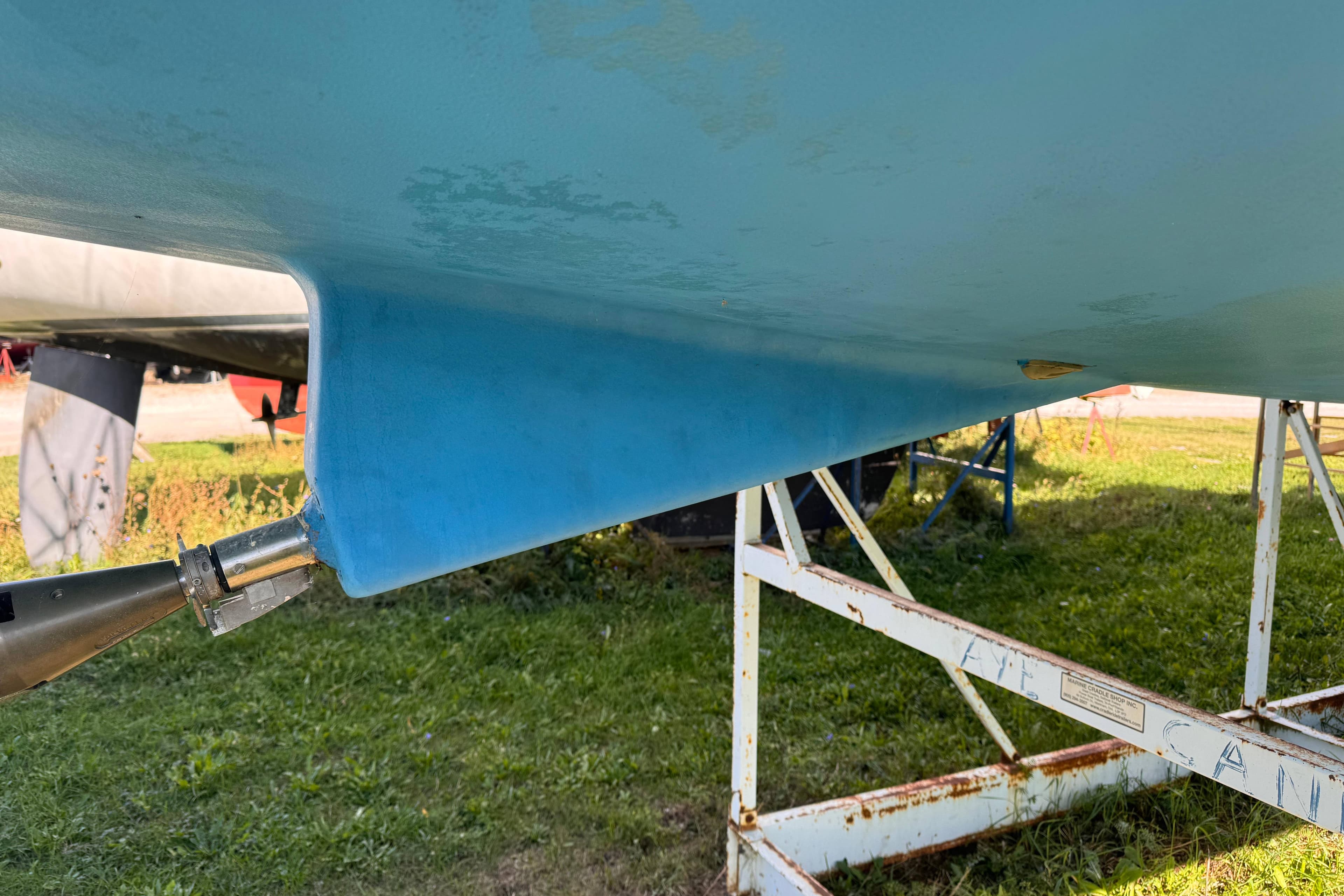 2007 Beneteau 423 sailboat hull on stand, showing keel and rudder details.
