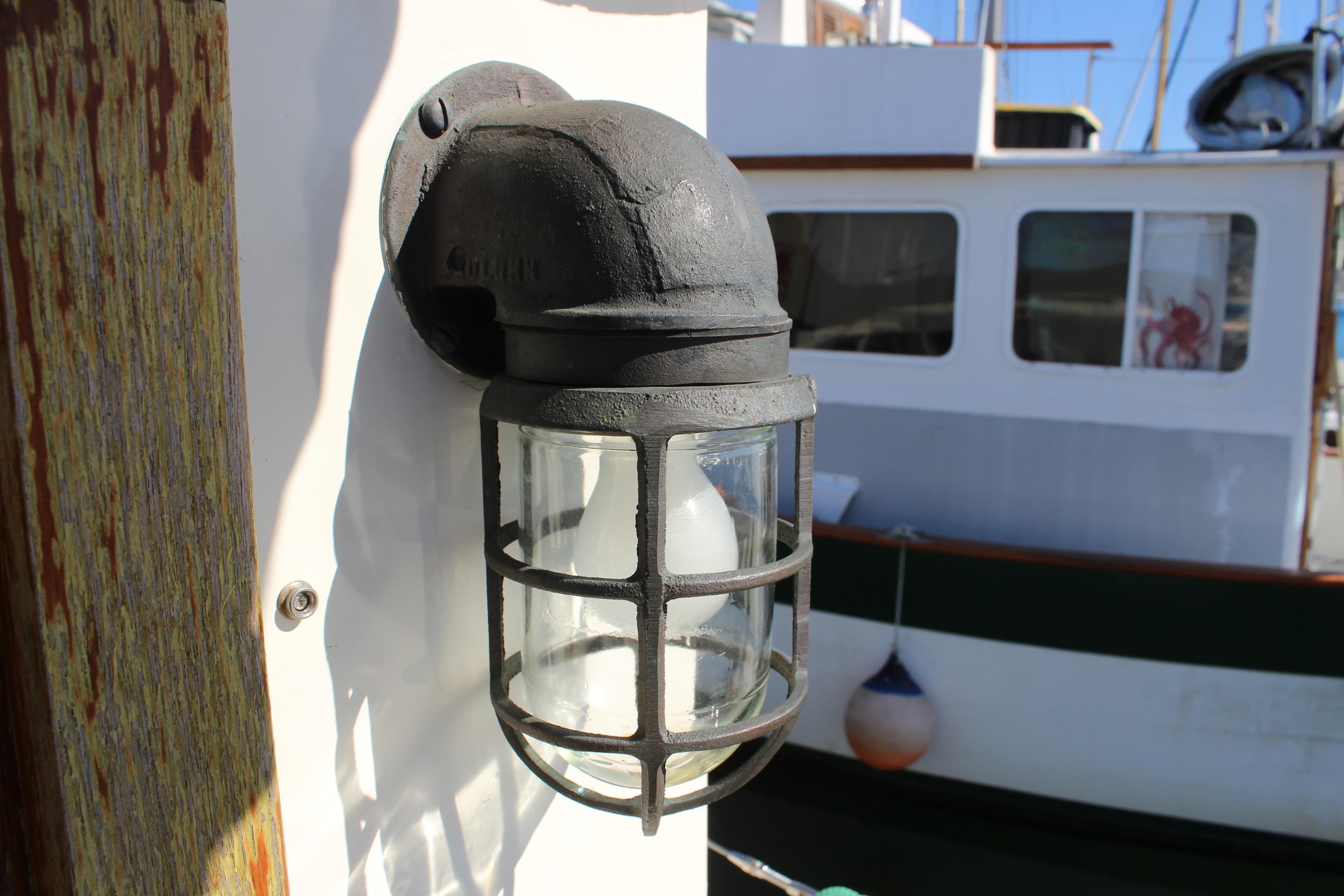 Vintage nautical light fixture on a 1972 Fisher 30 boat.