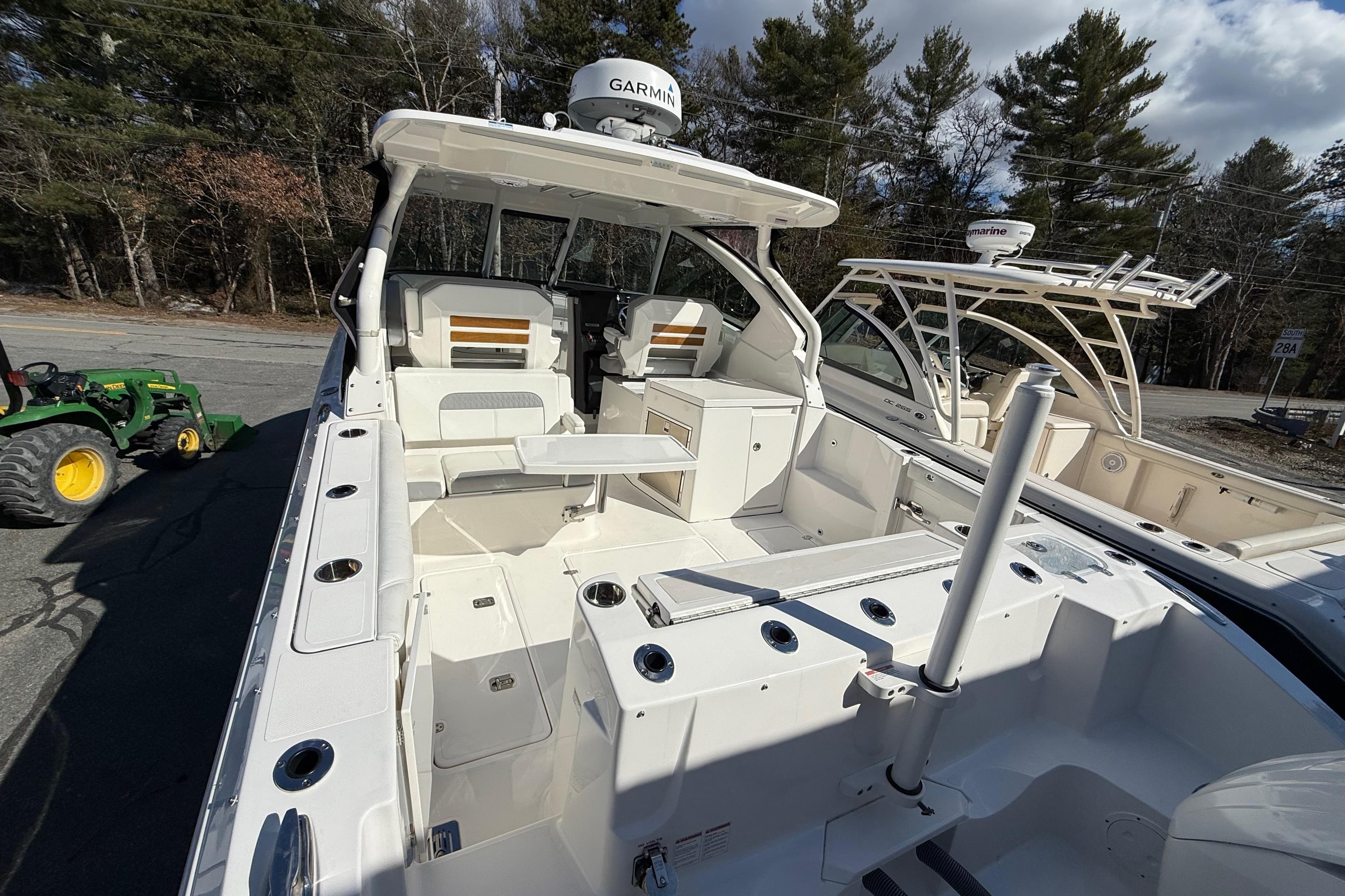 2022 Pursuit DC 326 Dual Console boat with spacious deck and modern amenities.