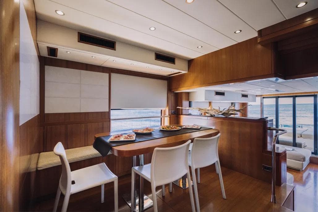 Luxurious 2015 VZ Explorer yacht interior with dining area and ocean view.