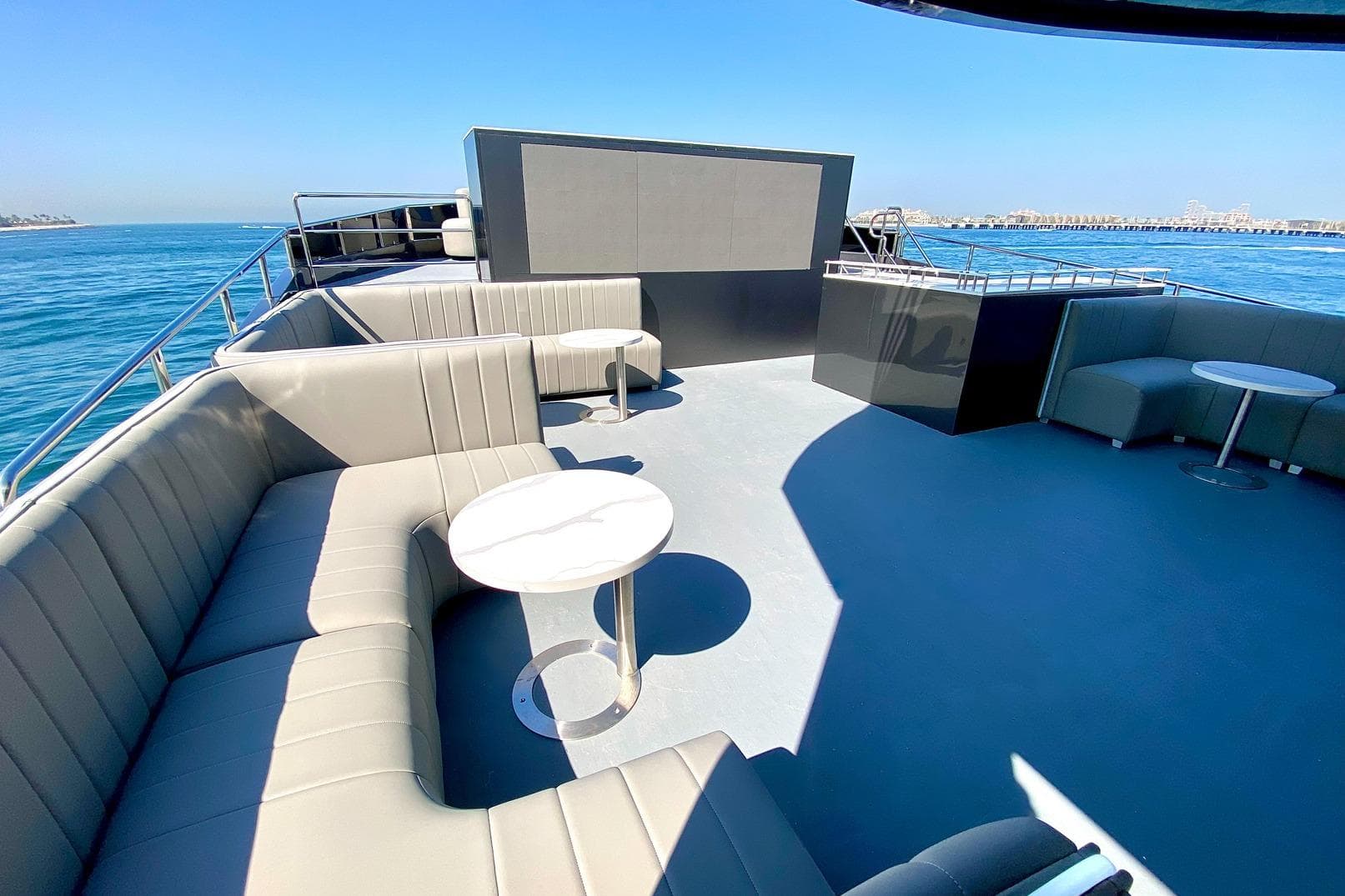Luxurious 2002 Custom Yacht 125 deck with elegant seating and ocean view.