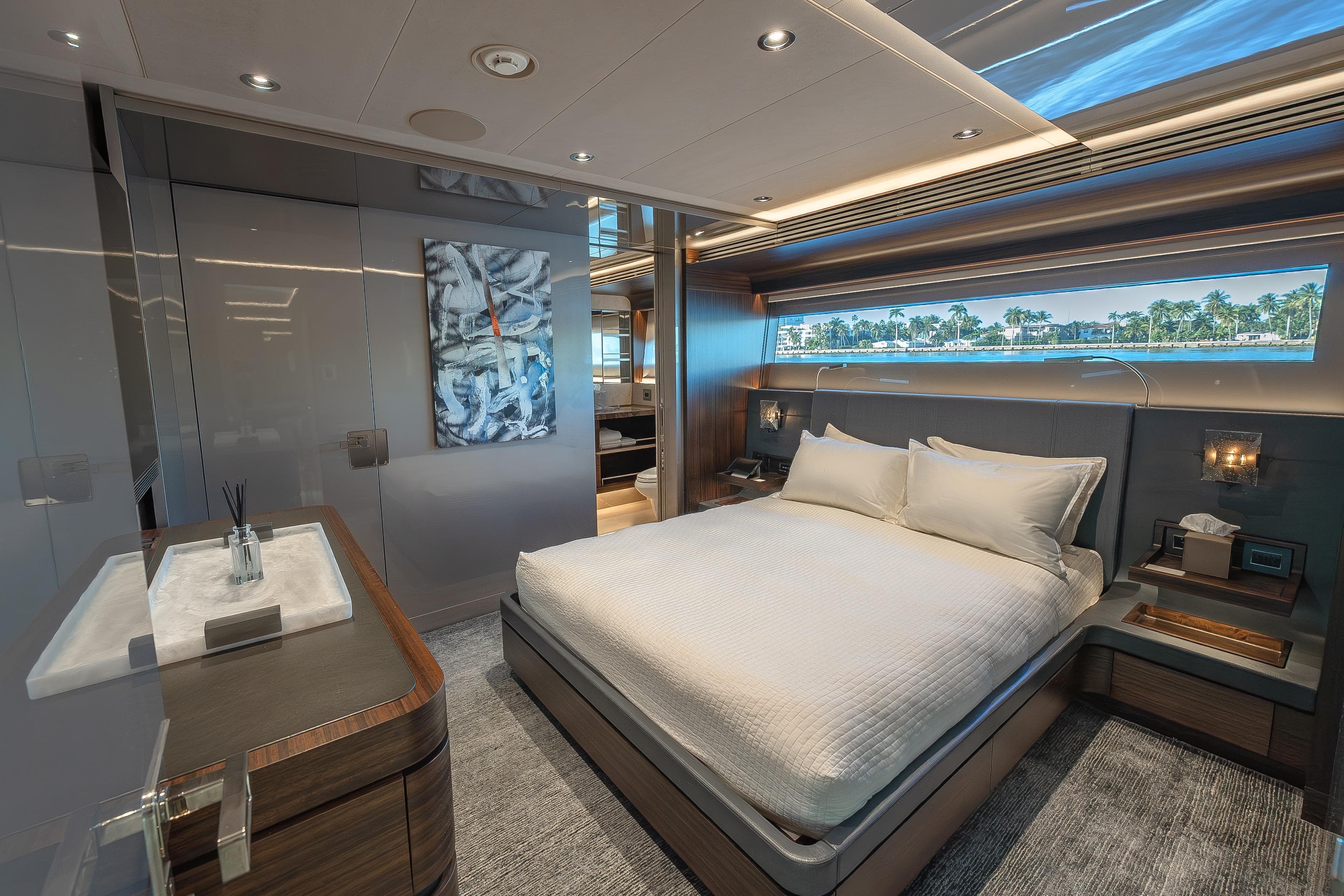 Luxurious bedroom interior of 2018 Westport Raised Pilothouse yacht with modern decor.