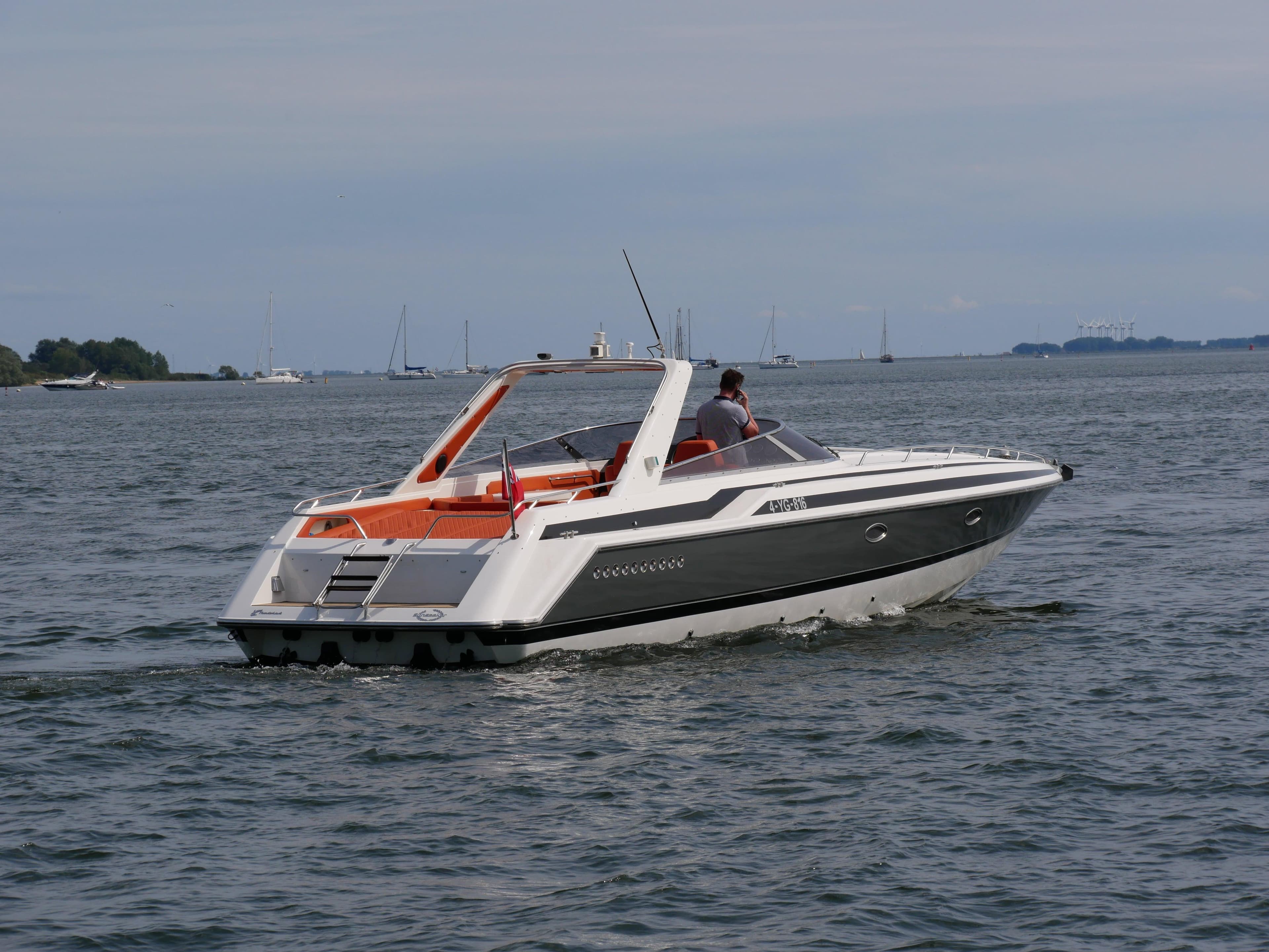 1991 Sunseeker Thunderhawk 43 cruising on open water, showcasing sleek design and performance.