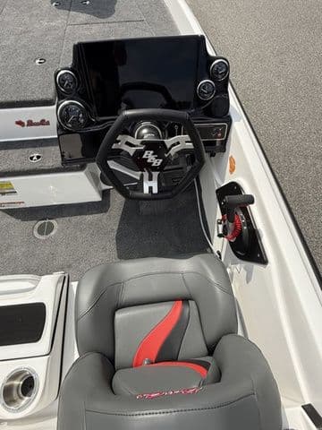 2026 Bass Cat Pantera Classic boat interior with steering wheel and seat, featuring modern design elements.