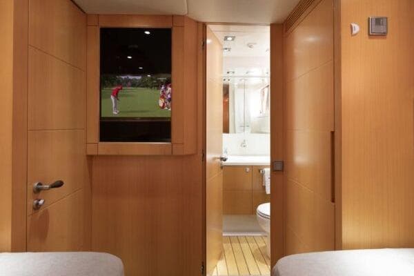 Luxurious Maiora 31DP yacht interior, featuring a modern bathroom and entertainment system, 2009 model.
