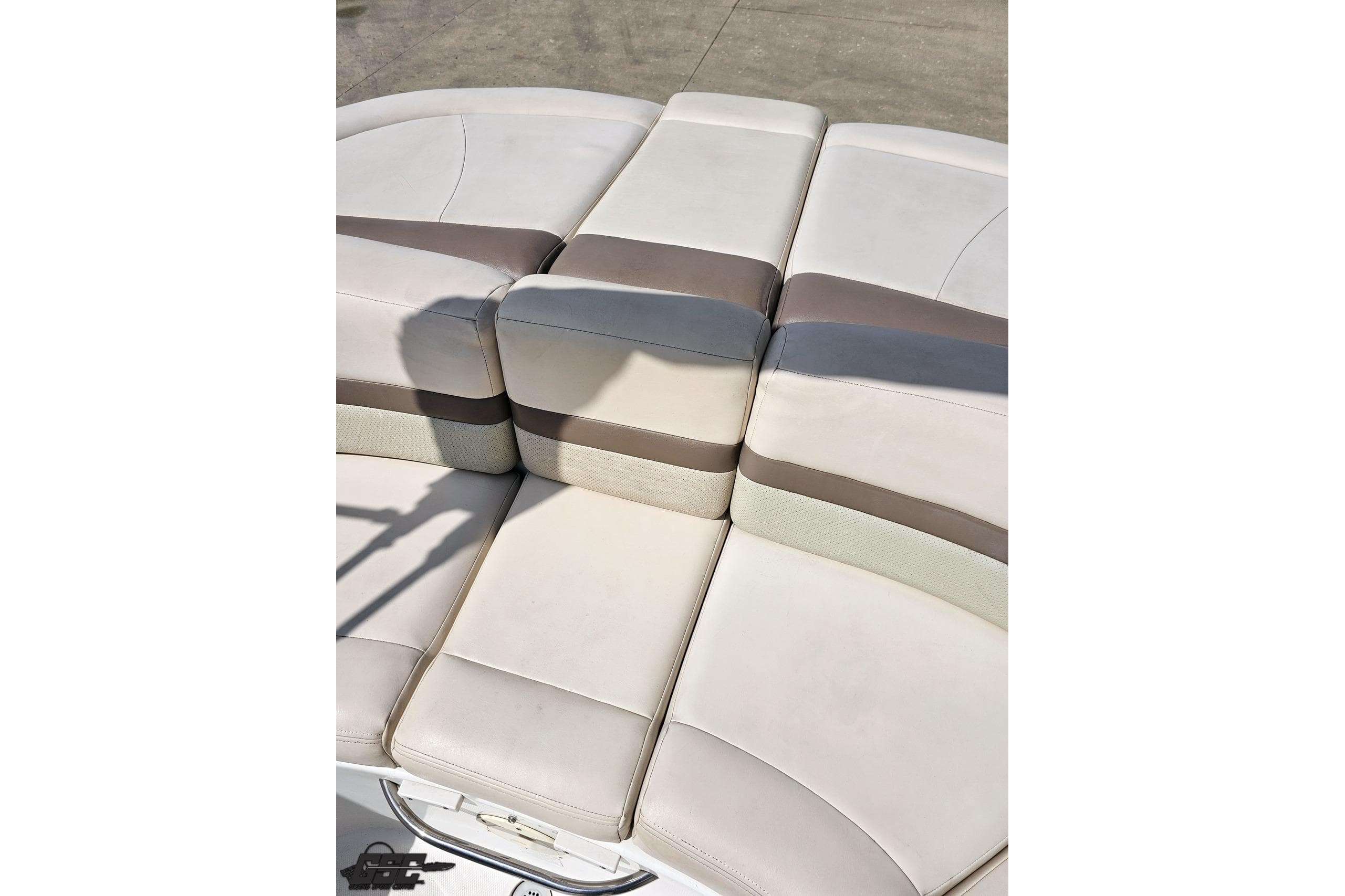 2007 Chaparral 256 SSi boat seating with beige and gray upholstery.