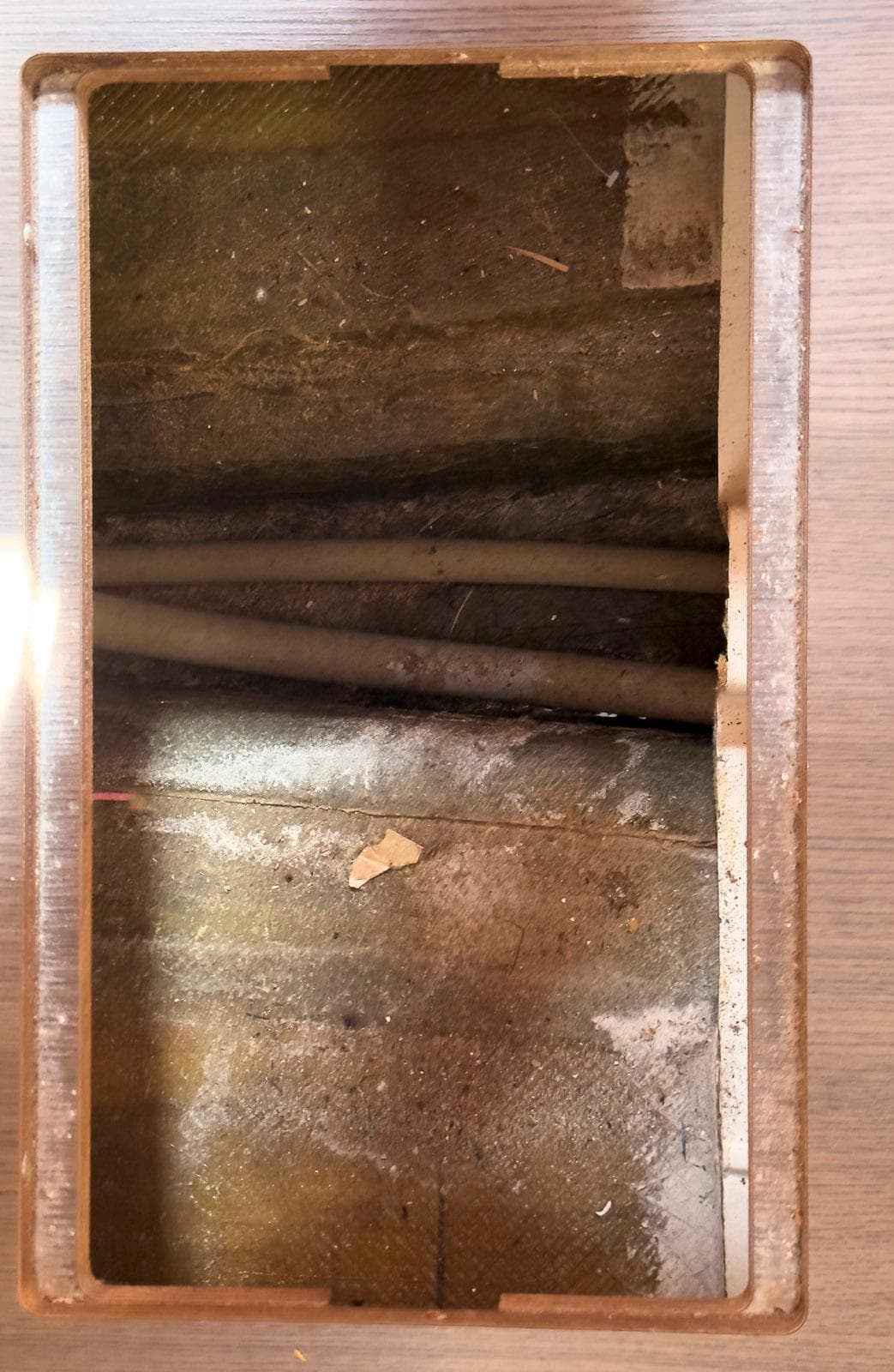 Interior view of a 2017 Lagoon 42 yacht, showing a compartment with visible pipes.
