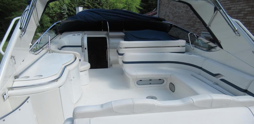 2000 Formula 400 SS boat interior with white seating and covered cockpit.
