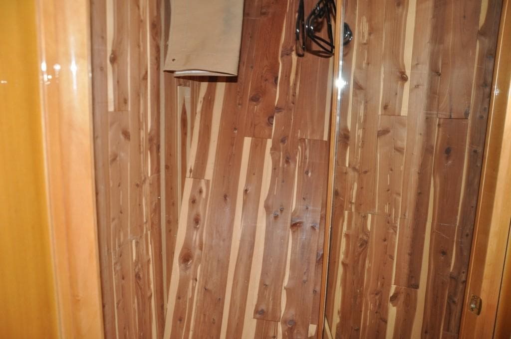Wood-paneled interior of a 2003 McKinna 58 yacht.