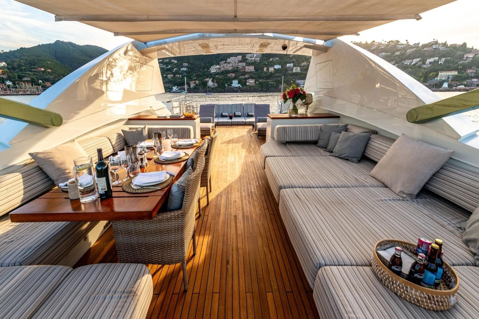 Luxurious 2010 Peri Yachts 29M Custom deck with elegant dining setup and scenic views.