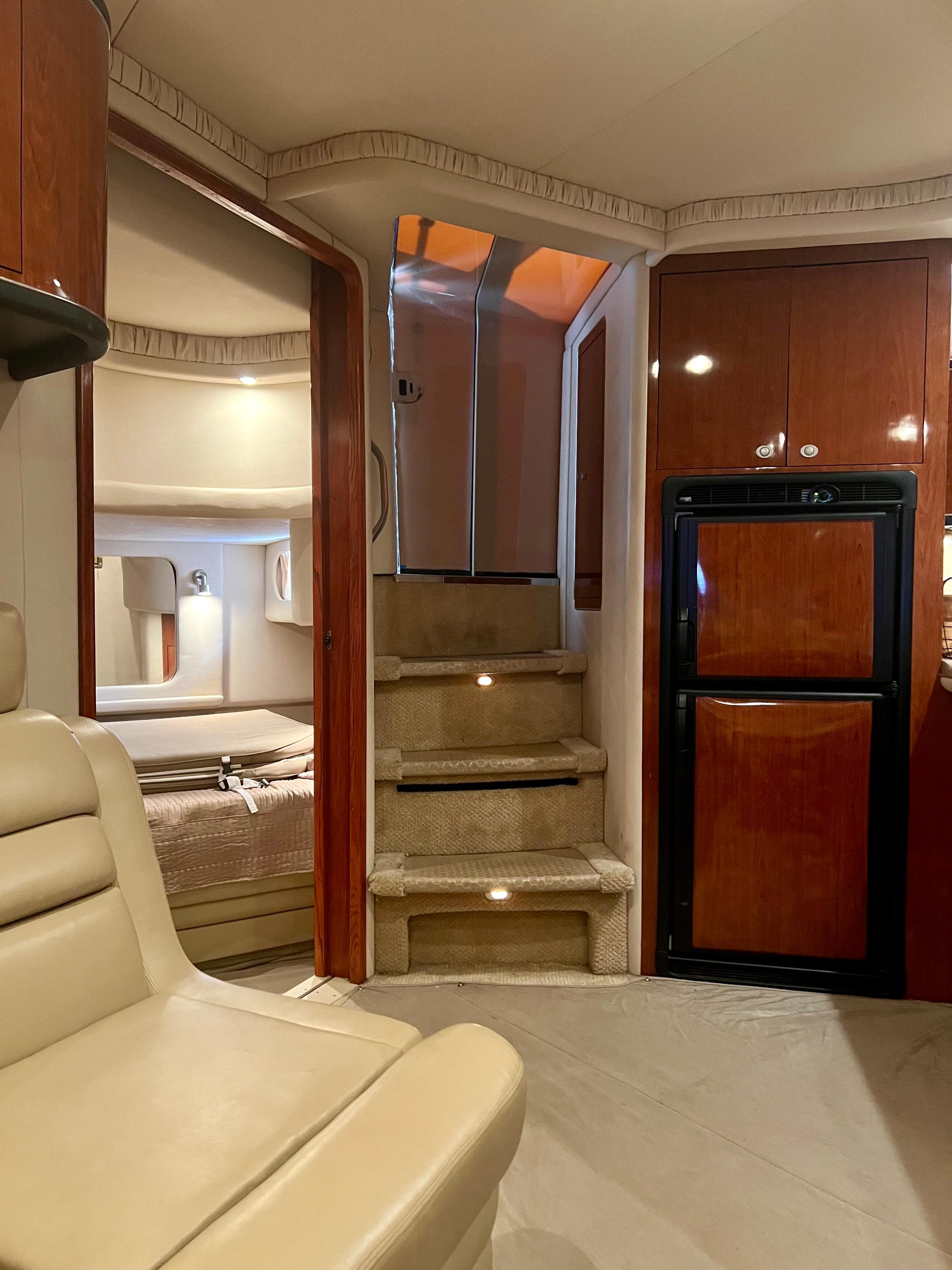 Interior of 2004 Sea Ray 46 Sundancer yacht with stairs and cabin.