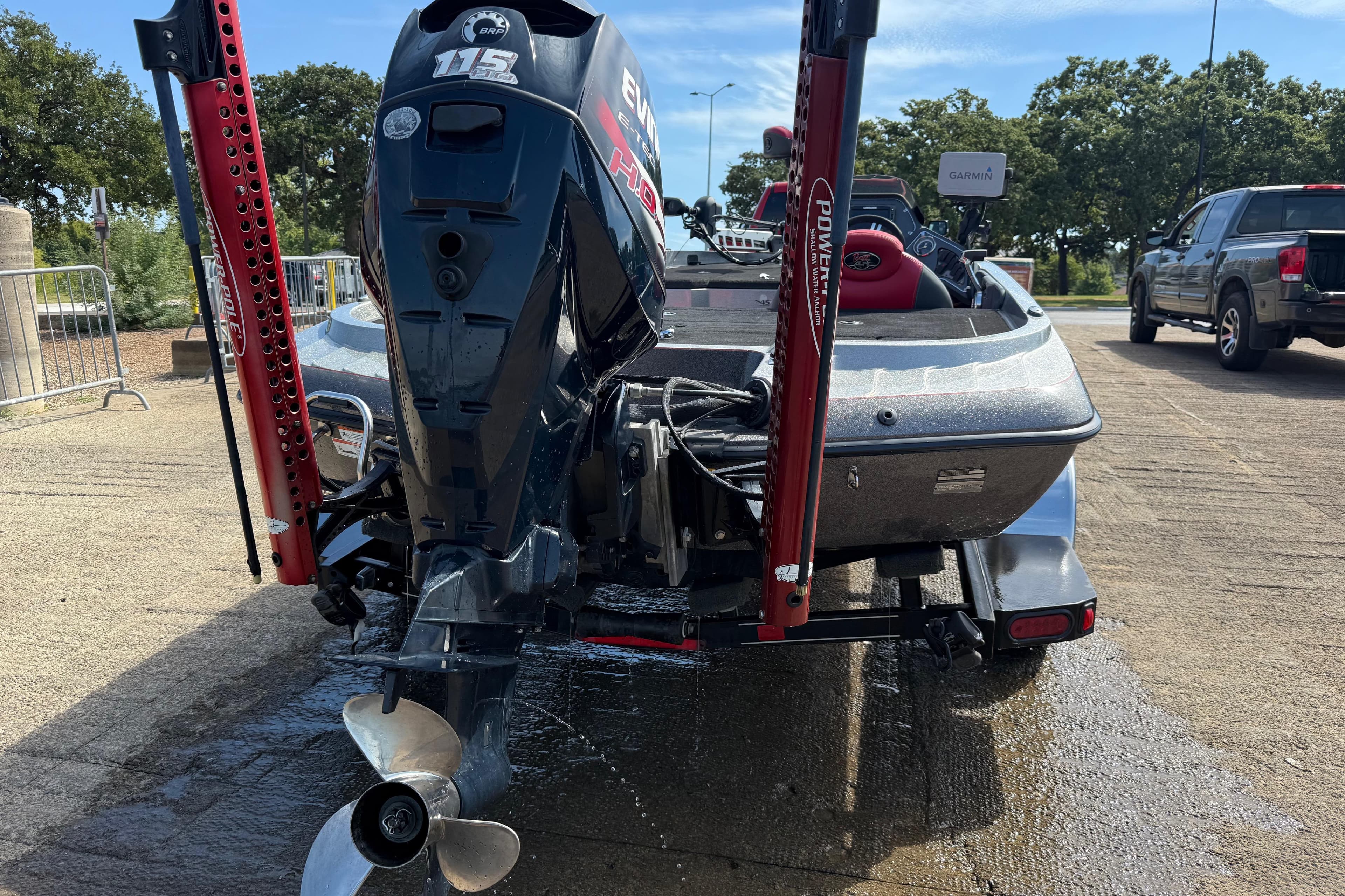 2013 Ranger Z117 boat with Evinrude 115 motor, parked on a trailer, ready for launch.