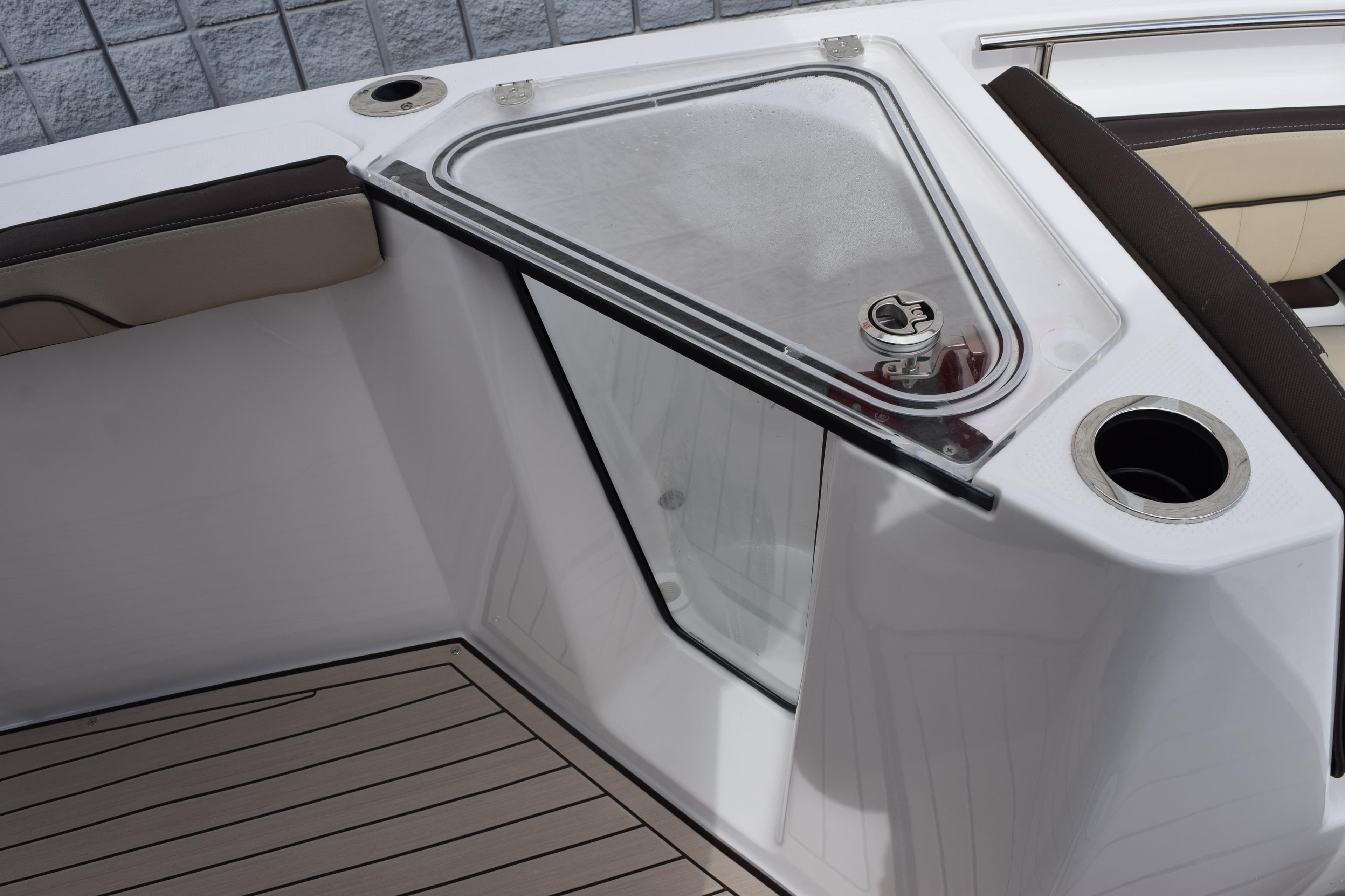 2026 Yamaha Boats 255 FSH Sport H interior with seating and storage compartment.