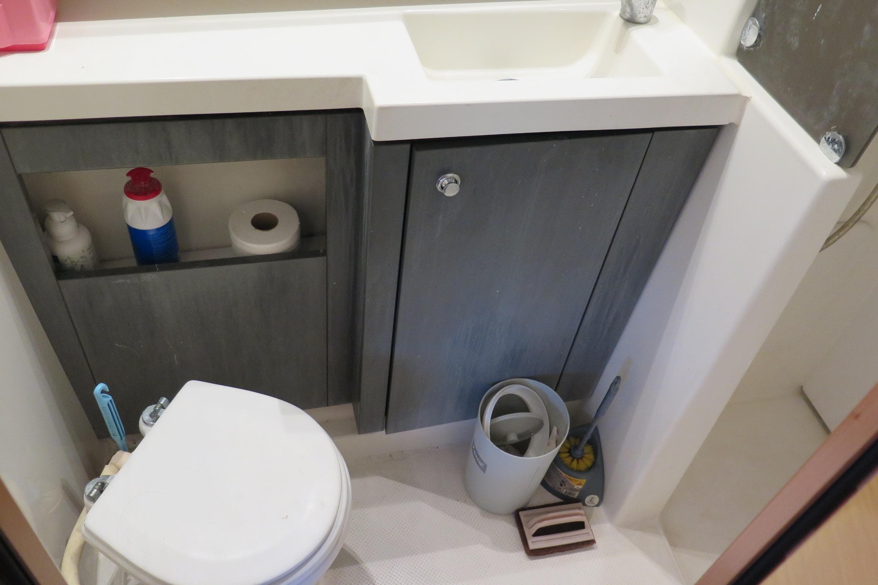 Bathroom interior of 2013 Fountaine Pajot Helia 44 catamaran with toilet and sink.