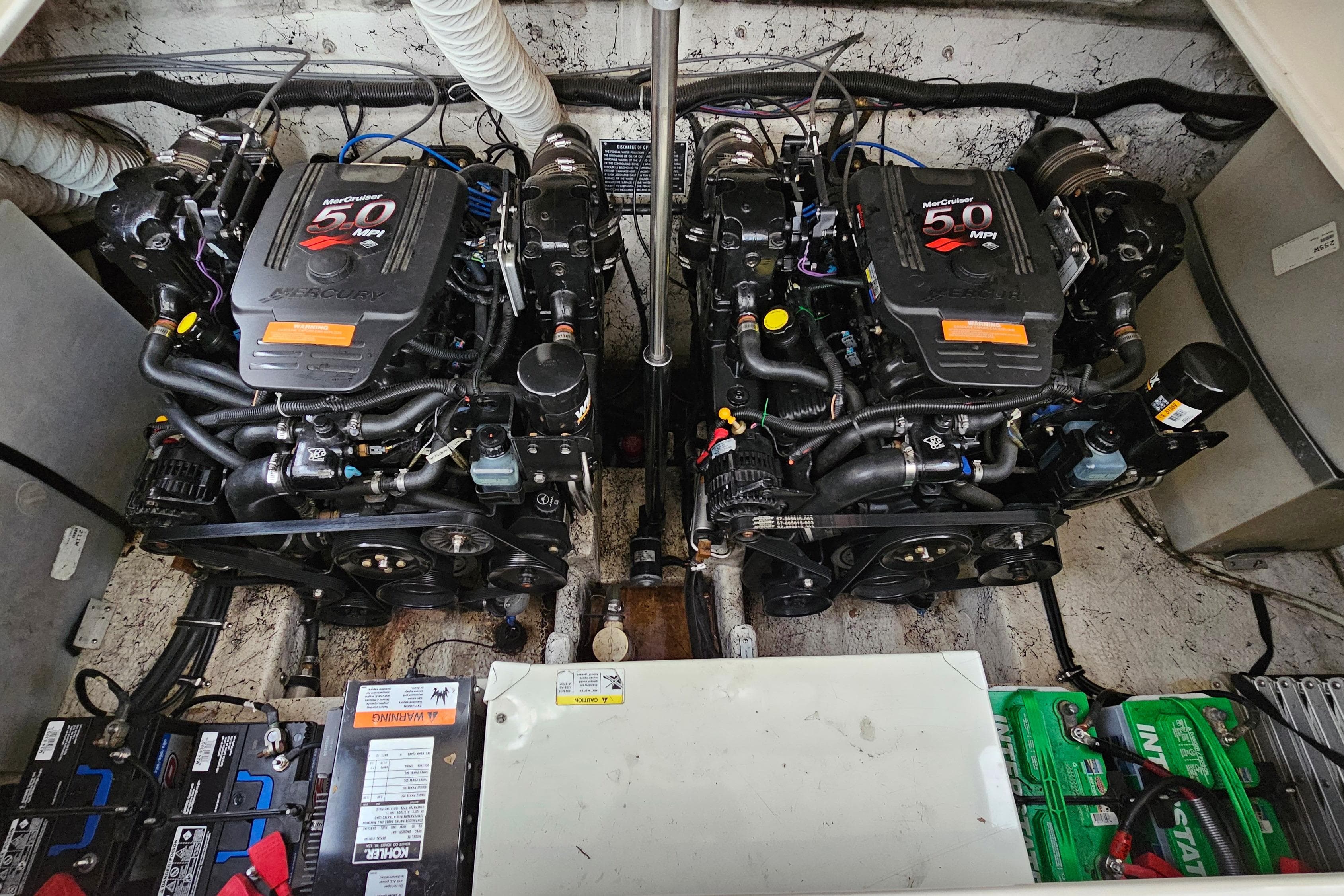 Twin MerCruiser engines in a 2004 Rinker Fiesta Vee 312 boat engine compartment.