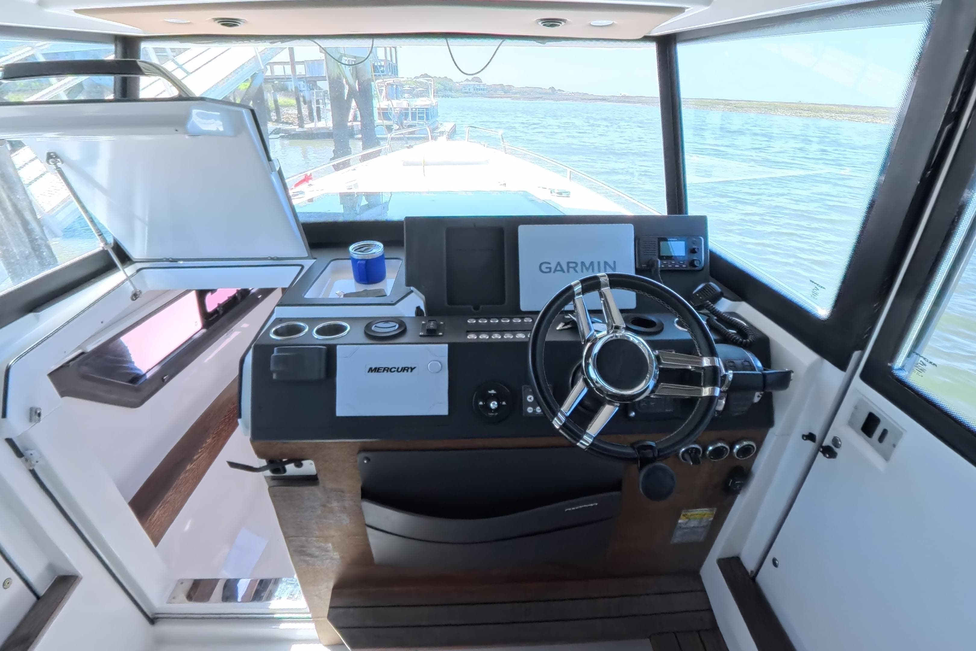 2019 Axopar 37 XC Cross Cabin helm with Garmin navigation and Mercury controls.