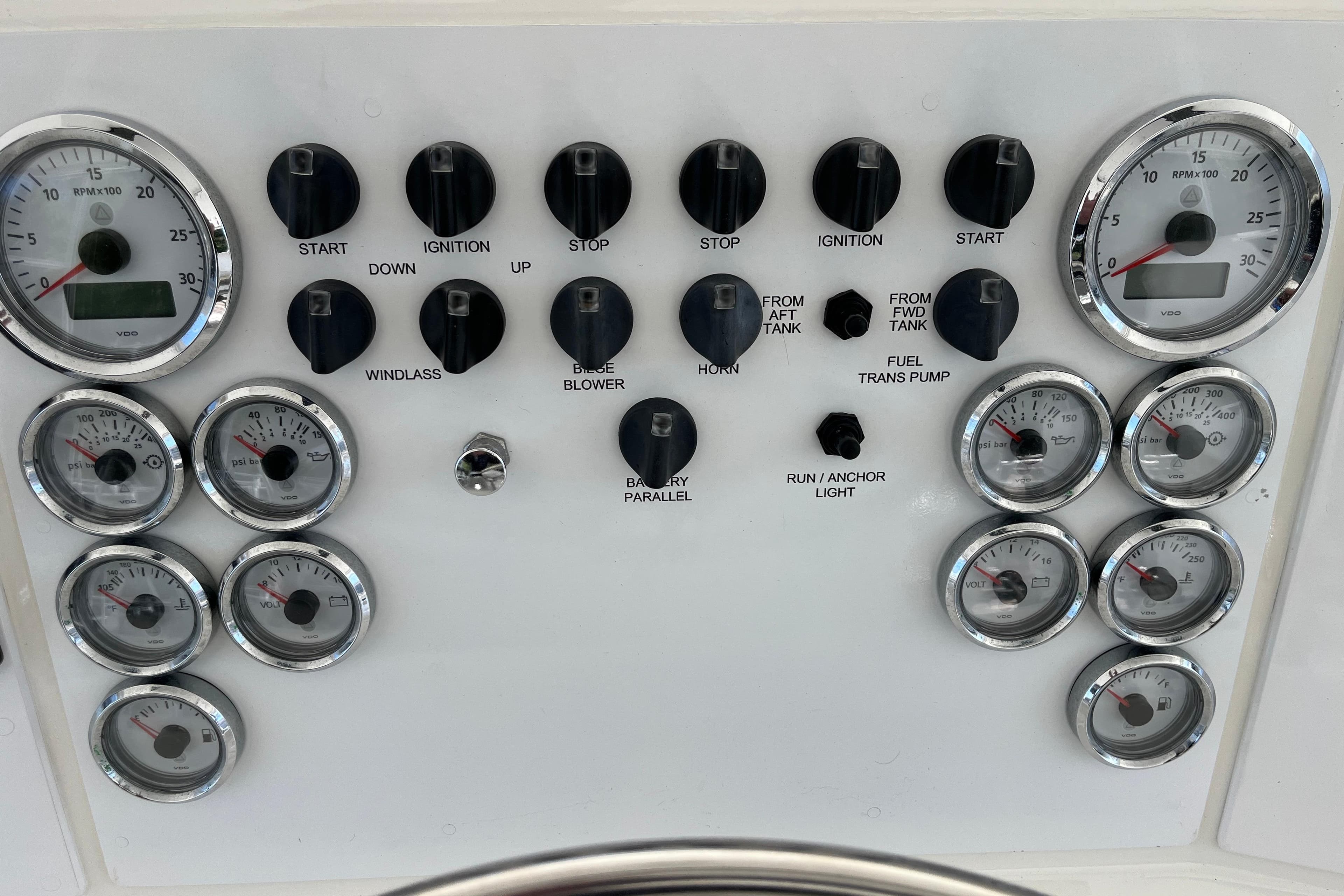 Control panel of a 1997 Post Sportfish boat with gauges and switches.