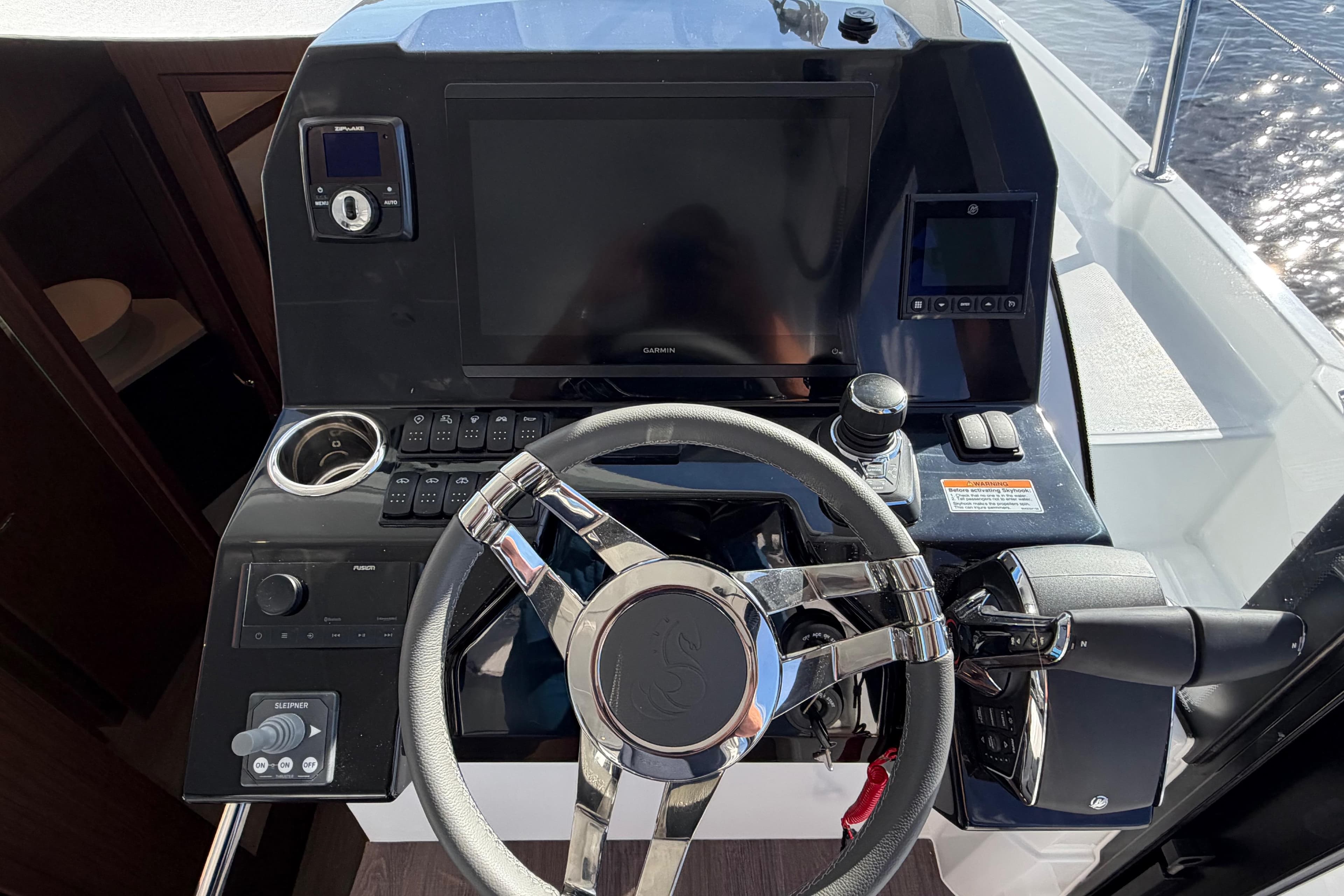 Helm of 2026 Beneteau Antares 11 Fly with modern controls and navigation display.
