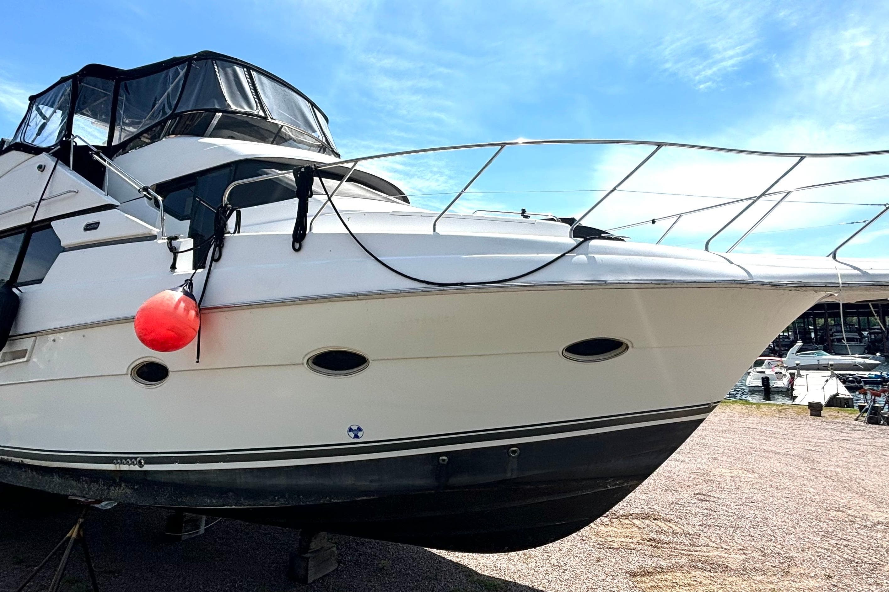 1999 Silverton 453 Motor Yacht docked, featuring sleek design and spacious deck.