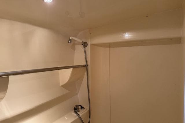 Shower area inside a 1997 Carver 350 Mariner yacht, featuring a sleek design.