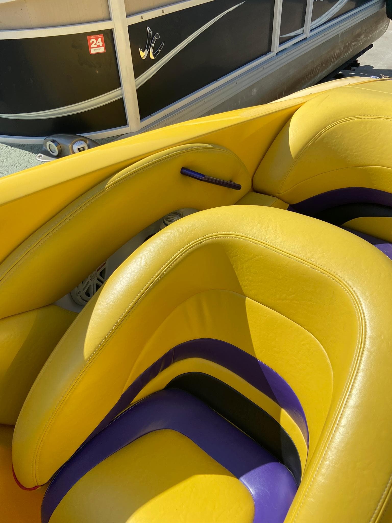 Yellow and purple seats of a 2001 Baja H2X boat.