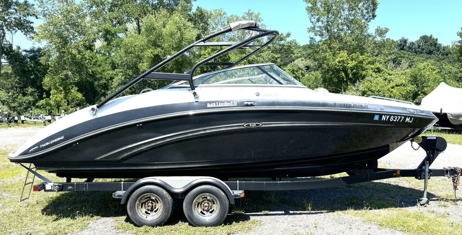 2013 Yamaha Boats 242 Limited S on trailer, parked outdoors.