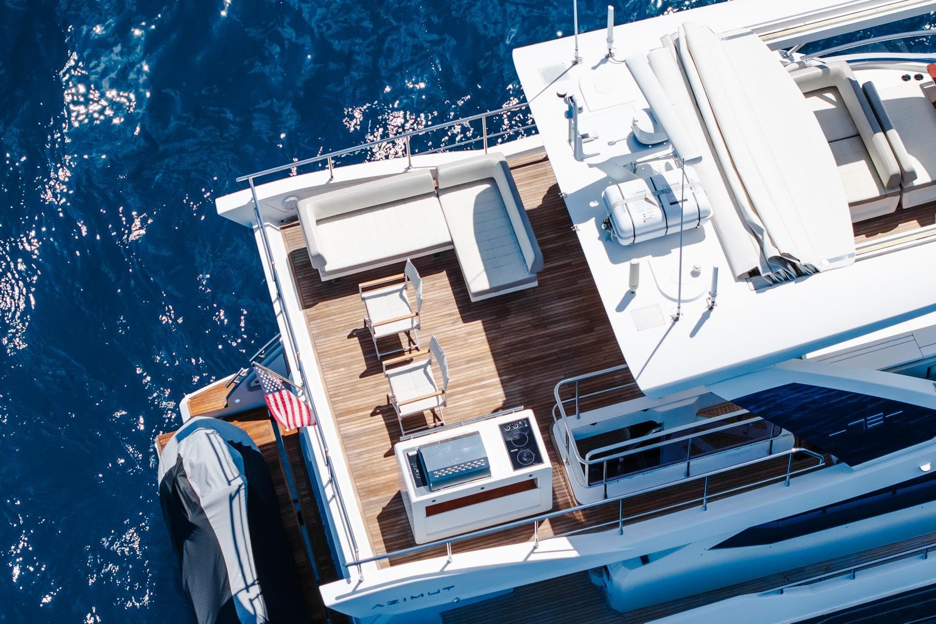 Aerial view of 2017 Azimut Fly 72 yacht deck with seating and ocean backdrop.