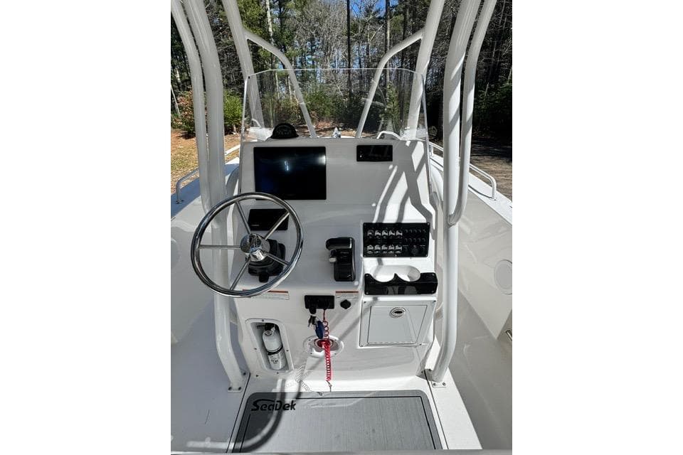 2021 Edgewater 208CC boat console with steering wheel and control panel.