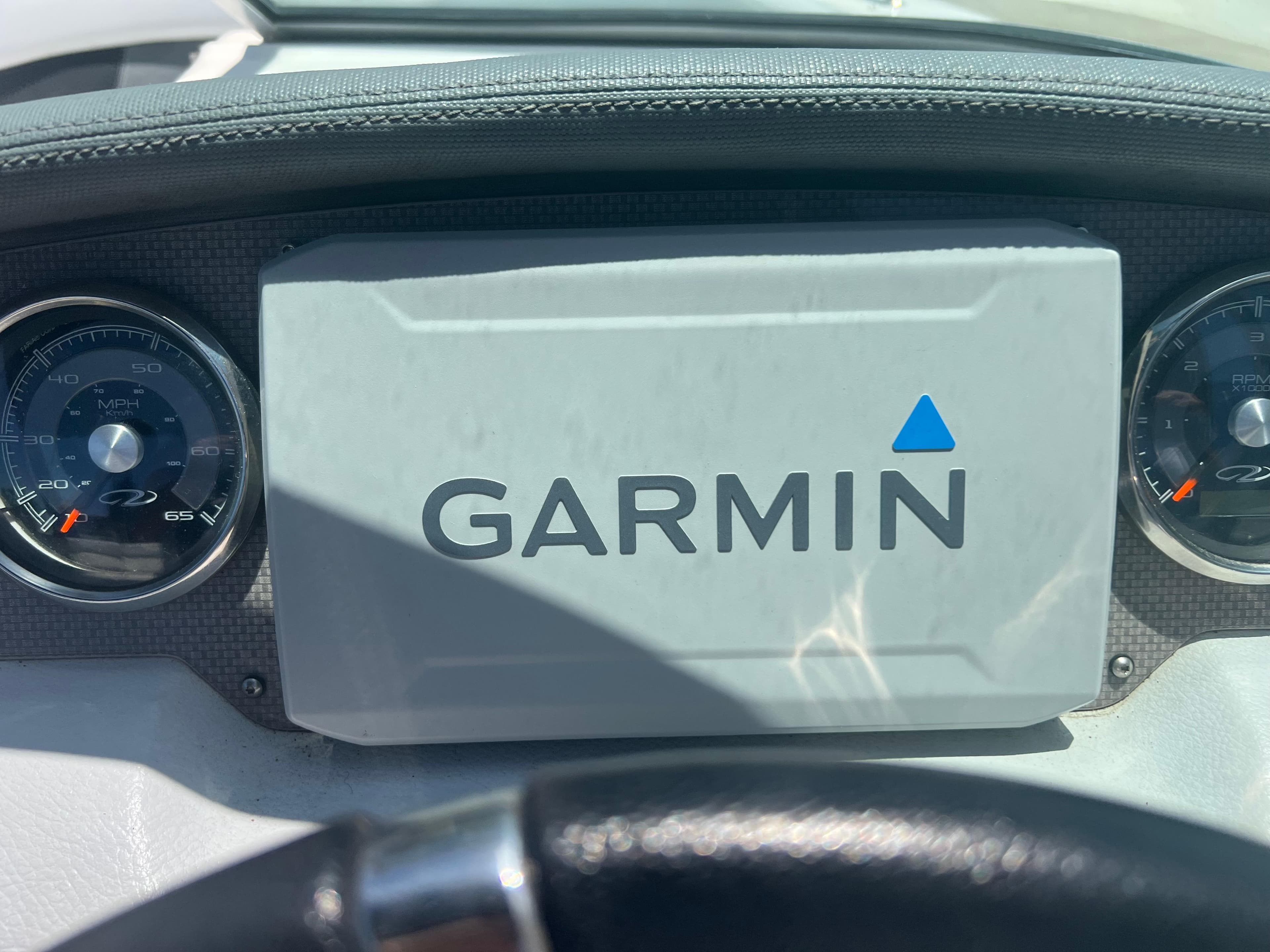 Dashboard of 2013 Regal 24 FasDeck RX with Garmin navigation system.