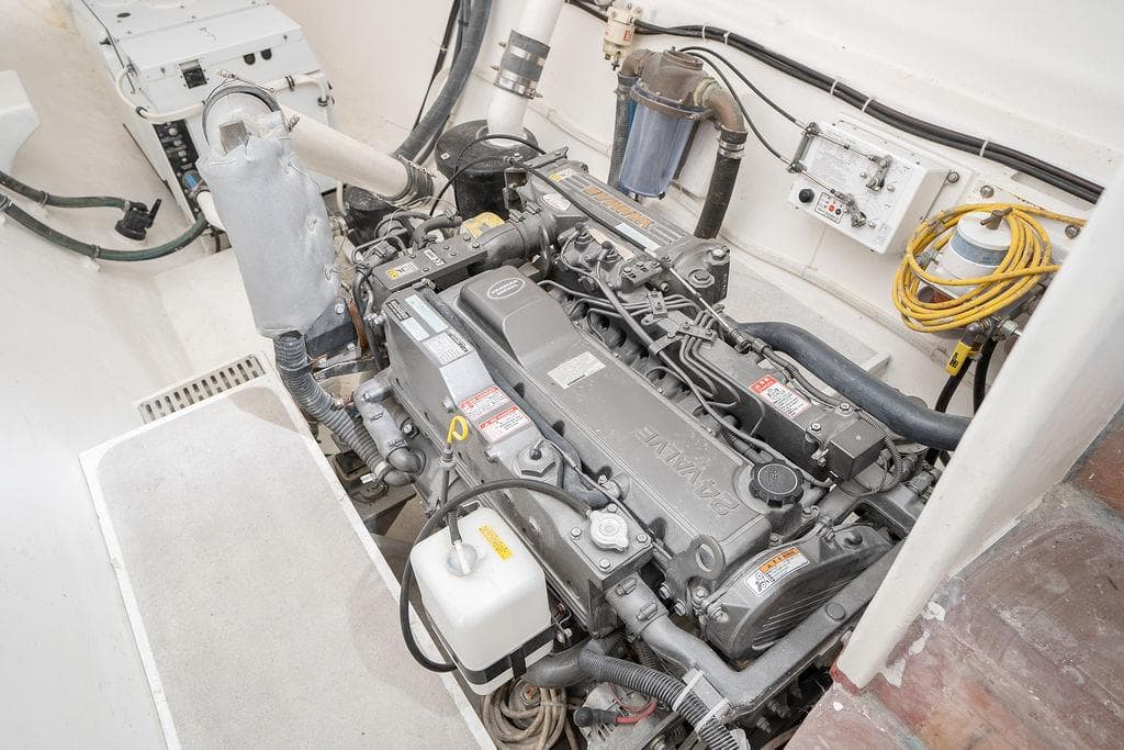 Engine room of 2025 Catamaran Bloomfield 86 Motorsailor, showcasing detailed machinery and components.