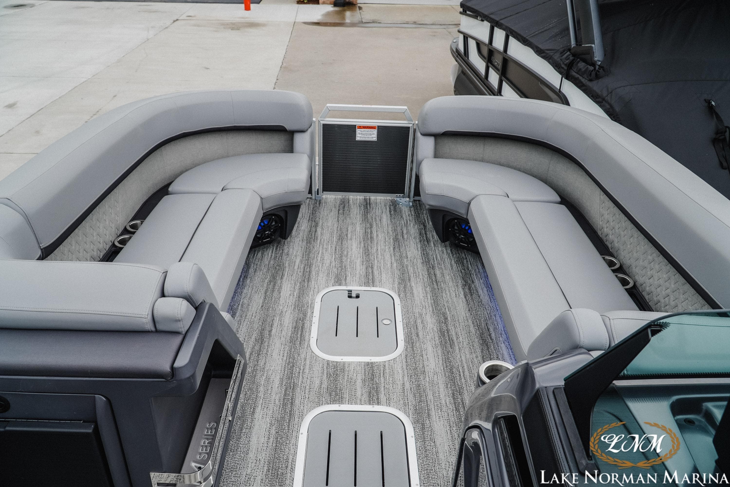 2025 Bennington 24MSB pontoon boat interior with luxurious gray seating at Lake Norman Marina.