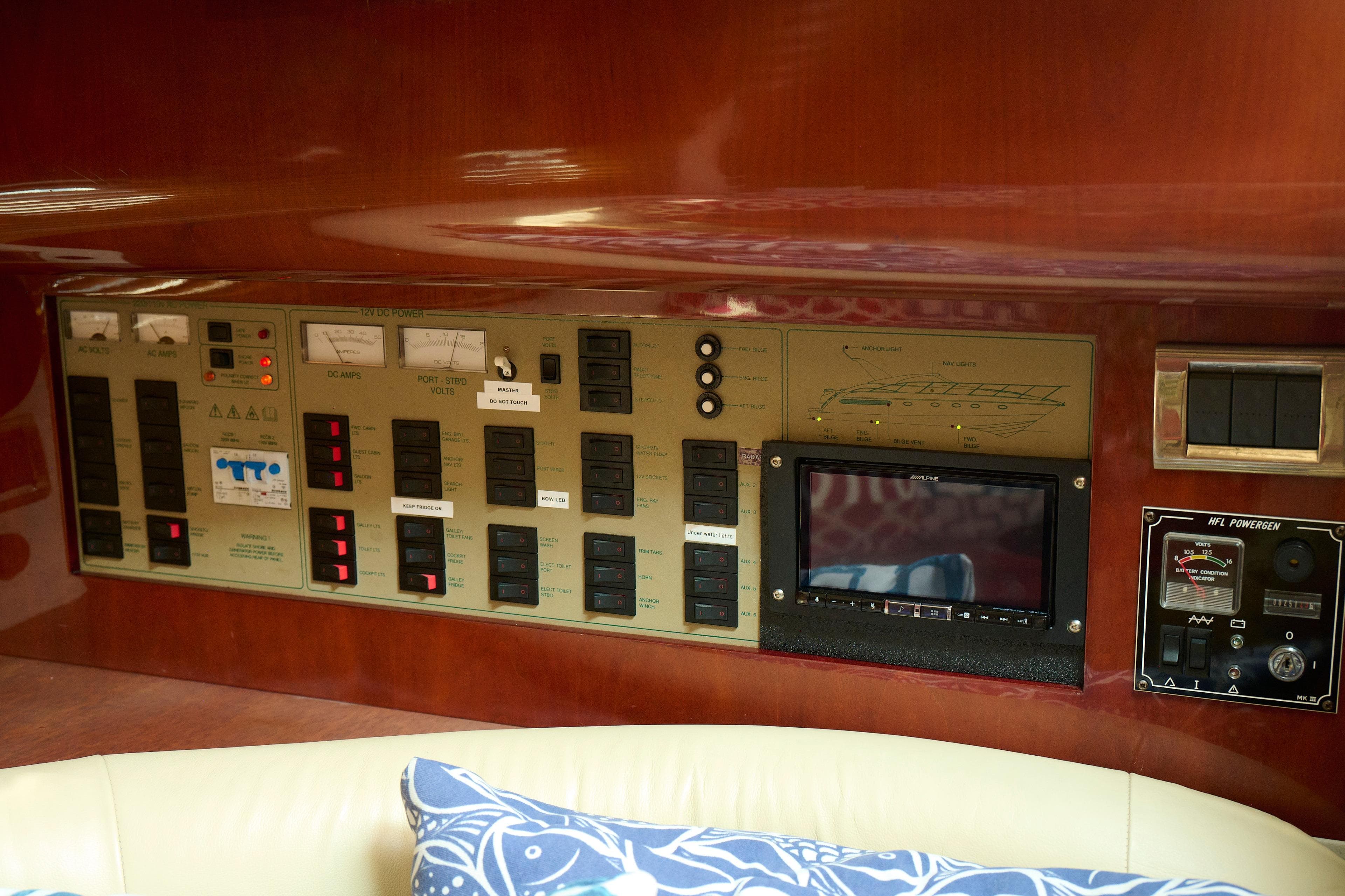 Control panel of a 2001 Fairline 43 yacht, featuring various switches and gauges.